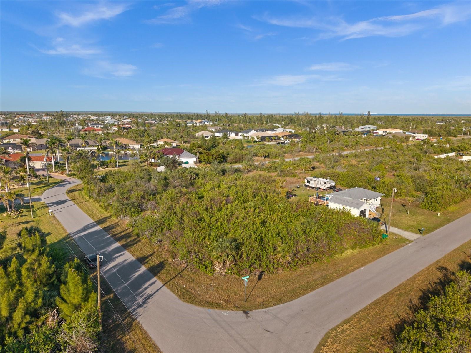 Welcome to your future homesite in the serene and rapidly growing community of Port Charlotte, Florida! This vacant corner lot, perfectly
situated in a tranquil residential neighborhood, offers an exceptional opportunity to build your dream home or investment property. Located in a
quiet area, this lot is just minutes away from local amenities including shopping centers, restaurants, schools, and healthcare facilities.
Surrounded by the lush greenery of Florida’s natural landscape, you can enjoy the peaceful atmosphere and the sound of native wildlife. The
proximity to parks, golf courses, and the stunning Gulf beaches provides endless outdoor activities such as boating, fishing, and hiking. Port
Charlotte is a growing community with increasing property values, making this lot an excellent investment opportunity for future returns.
Whether you are looking to build a family home, a vacation retreat, or an investment property, this lot offers a blank canvas to create your
vision. Embrace the Florida lifestyle and seize this chance to own a piece of paradise in Port Charlotte. Don’t miss out on this fantastic
opportunity to bring your dreams to life!