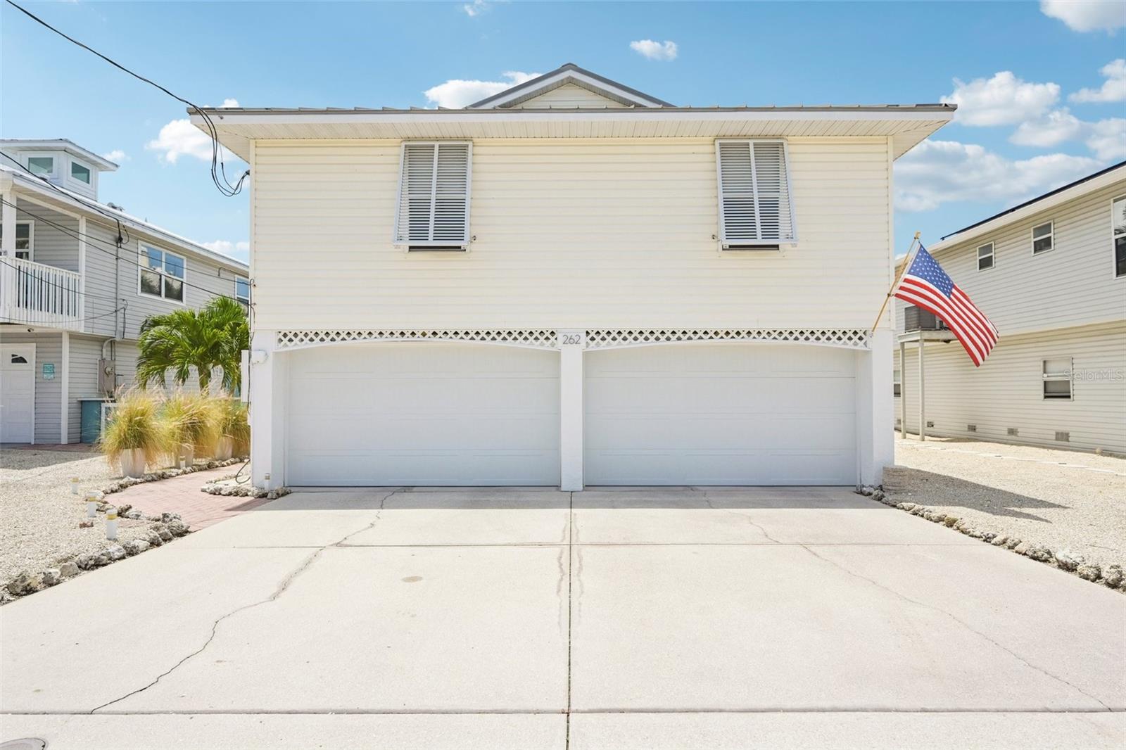 Beautifully modernized and well-maintained 3-bedroom, 2-bath home in the heart of Holmes Beach blending coastal charm with contemporary style. This move-in ready property features porcelain tile flooring throughout, an updated kitchen with oversized light and bright cabinetry, stone countertops, glass tile backsplash, built-in wine cooler, and an impressive 8-person dining island designed for entertaining.

Additional upgrades include AC replaced in 2022, a standing seam metal roof, LED hallway lighting and rechargeable remote blinds throughout. The renovated bathrooms boast floating vanities and frameless glass shower doors for a clean, spa-like feel.

The main-level storage area features epoxy flooring, while the maintenance-free deck and low-maintenance zeroscape yard (with room for a pool) make island living easy. S Harbor Drive residents also enjoy exclusive access to the private Sportsman Harbor Boat Ramp boat ramp with no HOA fees.

Ideally located near the beaches, dining, and shopping of Anna Maria Island, this property is perfect as a full-time residence, vacation home, or investment opportunity