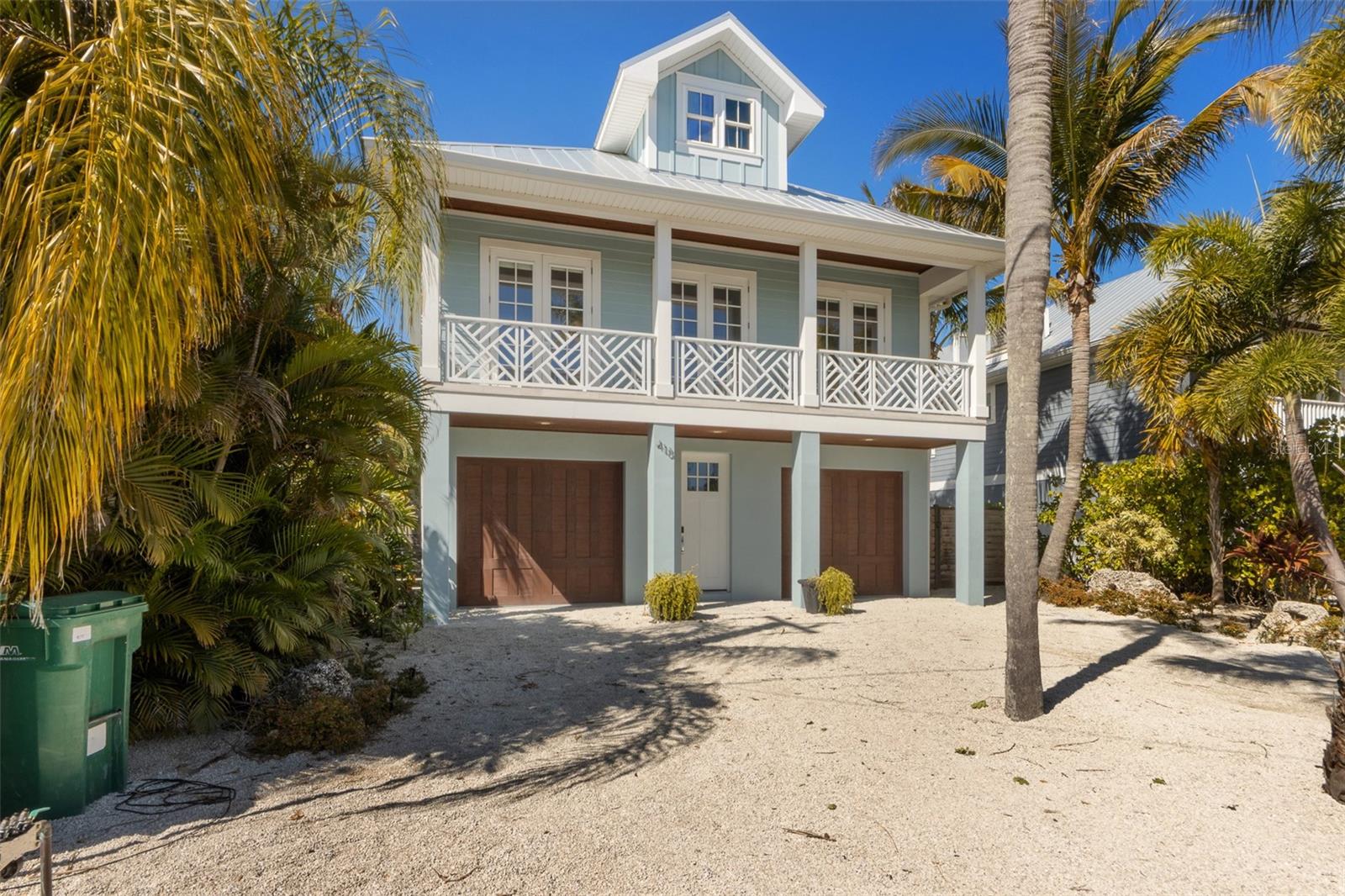 Welcome to the island lifestyle you've been dreaming of in the heart of beautiful Anna Maria Island! Perfectly positioned on the coveted north end of the island, this exceptional location places you just moments from the sugar-white sandy beaches of the Gulf and only a few blocks from the iconic Pine Avenue, where you'll enjoy locally owned boutiques, waterfront restaurants, charming cafés, art galleries, live music, and the beloved Anna Maria City Pier. Built in 2017, this elevated Key West-inspired POOL home offers nearly 2,200 square feet of beautifully designed living space with 4 bedrooms, 4.5 bathrooms, an elevator, and comes completely TURNKEY. Stepping inside, you'll immediately appreciate the open concept floorplan accented by gorgeous wood-look tile flooring throughout and a stunning shiplap wood vaulted ceiling that perfectly captures the home's coastal character. The kitchen is truly the heart of the home, featuring a large center island with generous barstool seating, top-of-the-line stainless steel appliances, a wine refrigerator, custom white cabinetry, a custom vent hood, and a modern backsplash that ties the space together beautifully. The living and dining areas seamlessly flow outdoors through sliding glass doors that open onto the expansive covered balcony. Overlooking your private tropical backyard oasis, this is the perfect setting for indoor-outdoor living and entertaining. Each of the four spacious bedrooms offers its own private ensuite bathroom, providing comfort and privacy for family and guests alike, while the additional half bathroom is perfectly situated for visitors. Take the spiral staircase down to your backyard retreat where resort-style living awaits. The under-home patio features a beautiful wood plank ceiling that adds even more coastal charm, along with an expansive entertaining area complete with a bar. The freeform heated swimming pool is the true centerpiece, featuring a built-in pool tabletop with umbrella space, a relaxing spa, and lush tropical landscaping that creates a private paradise you'll never want to leave. Currently operating as a profitable vacation rental, this home offers exceptional income-producing potential while also serving as the perfect personal beach retreat. Here, golf carts and bicycles are the preferred way to get around, towering palms line the streets, and every day feels like a vacation. Spend your mornings walking the beach in search of seashells, afternoons paddleboarding or boating on crystal-clear waters, and evenings watching spectacular Gulf sunsets before grabbing fresh seafood overlooking the bay. With no high-rise buildings, Anna Maria has preserved its authentic Old Florida charm while remaining conveniently close to Bradenton, Sarasota, St. Petersburg, and Tampa. Whether you're searching for a luxurious full-time residence, an unforgettable vacation home, or a high-performing investment property, there are few places quite like Anna Maria Island. This is a rare opportunity to own a piece of paradise in one of Florida's most sought-after coastal communities, schedule your showing today!