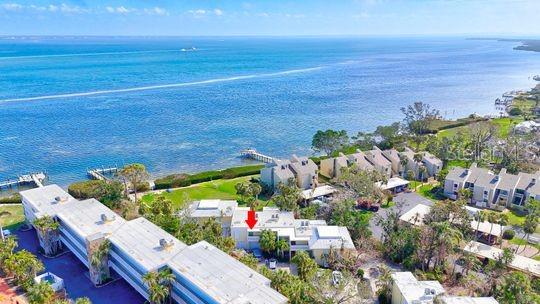 Bayfront Bliss with Gulf Access – Updated 1BR/1BA Condo-
Wake up to breakfast every morning watching breathtaking SUNRISE VIEWS over Sarasota Bay from your private lanai in this beautifully updated 1-bedroom, 1-bathroom bayfront condo. Located just steps from Gulf beaches, this prime location offers the best of both worlds—PRIVATE BEACH ACCESS to sugar-white sands or fishing and water activities off the new Beach Castle private pier on the bay. Inside, enjoy beautiful bay views from waking up in your bed or throughout the living room and the modern comforts of a new furnace and central air (2022), along with stylish updates throughout. The community features a heated pool and whirlpool, perfect for year-round relaxation and pickleball and tennis courts for some afternoon fun. Beach Castle is one of the few Longboat key properties grandfathered in to allowing short term rentals year around which provides a fantastic opportunity for vacation rental income. Whether you're looking for a personal retreat or an investment property, this bayfront gem its PRIME LOCATION is a must-see!