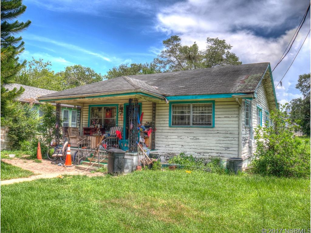 This classic home from the 1950's needs a LOT of love. Great location centrally placed in the historic district of New Smyrna Beach. Right down the street from old downtown Canal St & the "Babe" James Community Center. Pettis Park is just to the North. Link up with the famous NSB "Loop" less than a mile to the East. With almost a quarter of an acre there is plenty of room in the back yard too! ;Water: City