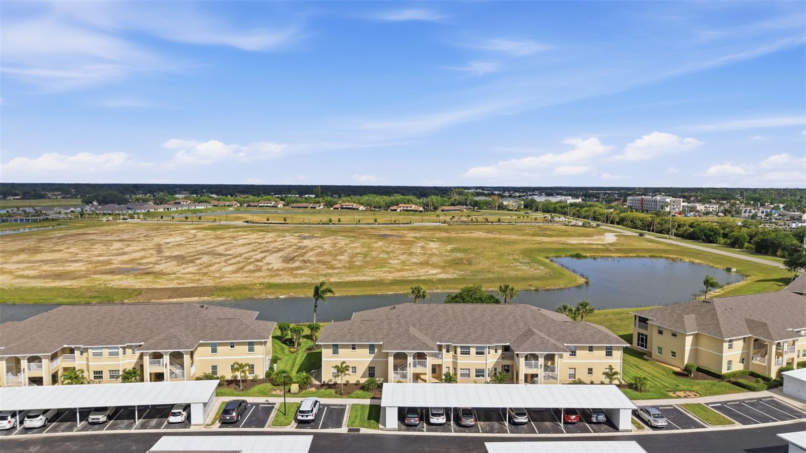 Low-maintenance living with water views… without sacrificing space.

This 3-bedroom, 2-bath condo stands out for one reason buyers keep asking for… room to actually live, not just visit.

The layout opens up immediately with a bright living and dining space, where large windows and sliding doors frame peaceful water views and bring in natural light all day.

The kitchen is practical and inviting, with stainless appliances, plenty of cabinet space, and a sunny eat-in area that feels separate without being closed off.

The primary suite offers what you want at the end of the day… space, privacy, a walk-in closet, and a clean, functional bath with dual sinks and a walk-in shower.

Two additional bedrooms give you flexibility for guests, a home office, or both… without feeling cramped.

Step onto the screened lanai and this is where it clicks.
Wide water views. Open green space. Quiet. No distractions.
The kind of setting people picture when they think about slowing things down.

The community is gated, well-maintained, and intentionally low-key, with a pool, sidewalks, and a tucked-away feel that keeps it peaceful but still close to everything.

Covered carport, in-unit laundry, hurricane shutters… all the practical pieces are already handled.

If you’re looking for something simple, quiet, and easy to maintain… this checks the boxes without overcomplicating it.
