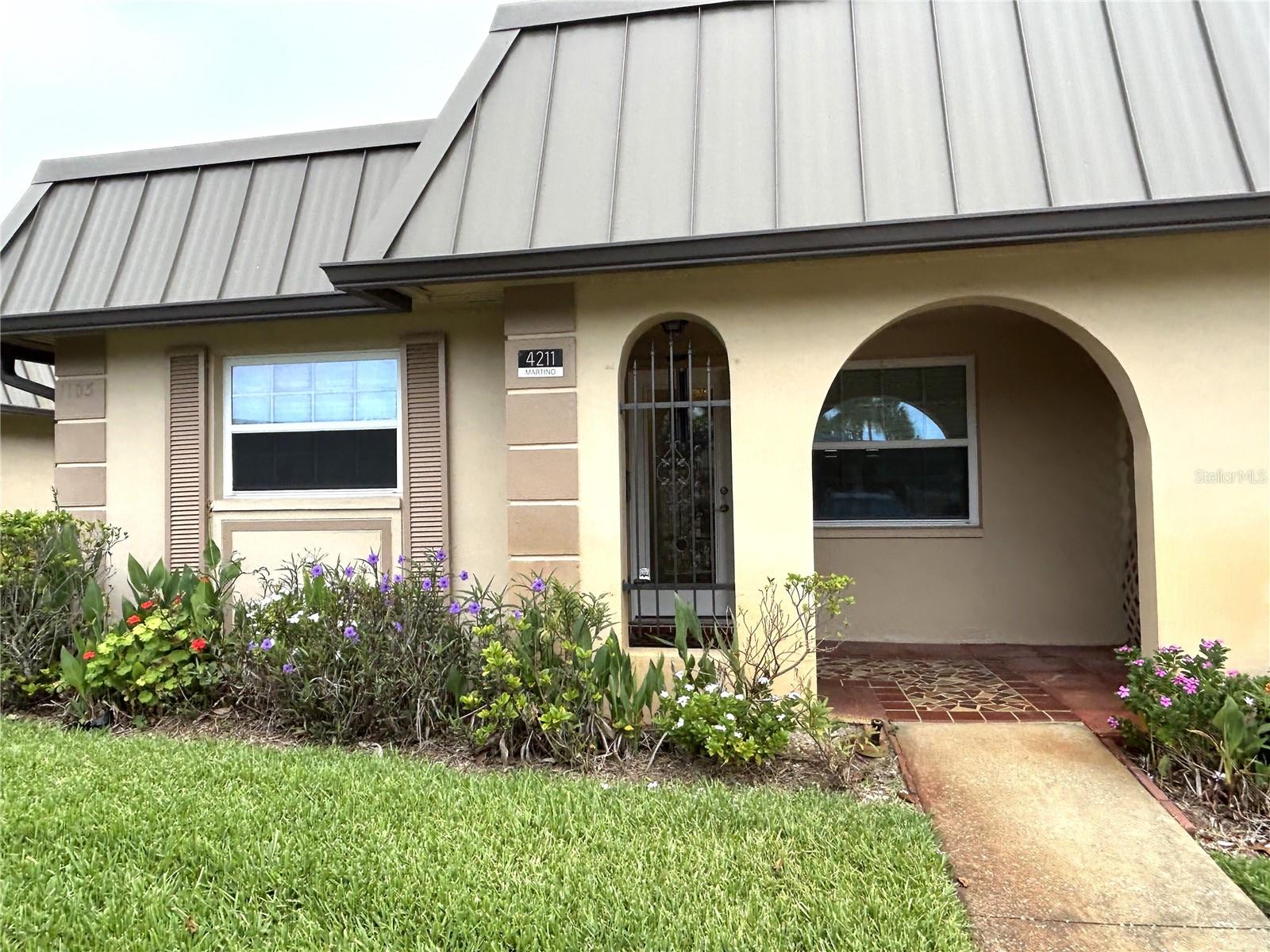 This 1st floor condo for rent is in the well maintained, gated community of Gardens of Beacon. This spacious condo has been completely remodeled. The kitchen has granite counters and matching stainless steel appliances. Two spacious bedrooms and two beautifully renovated full baths. No carpet, beautiful vinyl throughout entire condo. In unit full size front load washer and dryer makes laundry a snap. One assigned covered parking space. Located next to the clubhouse and built-in pool, with a nature walk, gazebo overlooking the pond  The community is conveniently located near shopping and restaurants within minutes from the Gulf of Mexico. Come experience the maintenance free Florida lifestyle! Immediate occupancy, a must see, schedule your tour today.