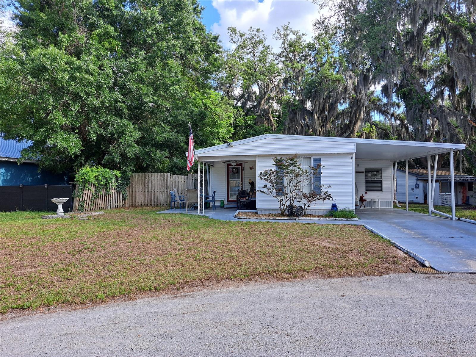 Welcome to this versatile and multipurpose property located on a quite cul-de-sac. Well maintained 3-bedroom, 2-bathroom mobile home features a comfortable and functional layout. Convenient indoor laundry with two of the bedrooms having built in beds and dressers making this property move in ready.  Step outside to find one of the standout features- a large detached garage, perfect for storage, a workshop, car enthusiast or hobbyists, it has electricity and water. In addition, the cute cottage offers a 1-bedroom, 1-bath with a living room offering extra space for guests, rental income or amazing office. This property sits on just over a quarter acre with mature landscaping providing tranquility and shade from the hot summer days. Located near the Auburndale Flea Market and amenities with a quite setting, nothing will compare. These types of properties do not come up everyday. So much potential for an Investor or add to your portfolio. Call today for a Showing!!