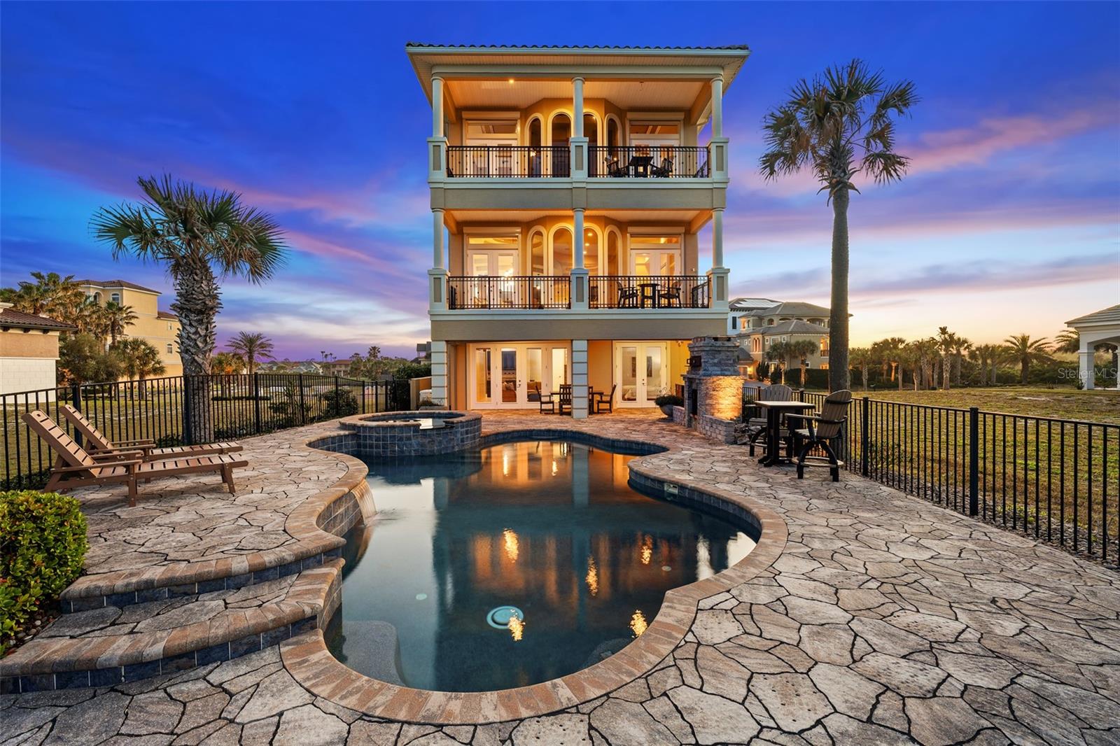 Enjoy truly spectacular oceanfront living with sweeping views of the Atlantic Ocean and the 9th hole of the Jack Nicklaus Signature Ocean Course from this exceptional 3-story  residence in the exclusive Ocean Hammock community.

Designed to capture the views from nearly every vantage point, this 4-bedroom, 4-bathroom home with over 4,300 square feet offers an elevated coastal lifestyle. The spacious primary suite is a private retreat featuring a balcony overlooking the ocean and golf course, fireplace, wet bar, and a spa-inspired bathroom, all perfectly positioned to take in the sunrise.

An elevator and elegant spiral staircase provide seamless access to each level, while expansive impact glass windows and doors fill the home with natural light and frame the breathtaking surroundings. The kitchen is well-appointed with generous storage, upgraded appliances, and seating ideal for entertaining.

Outdoor living is just as impressive, with a pool and spa overlooking the ocean, an outdoor fireplace, and multiple balconies designed for relaxing or hosting while enjoying the coastal breeze. For those seeking an expanded estate setting, the adjacent homesite at 8 Hammock Beach Court is also available, presenting a unique opportunity to secure additional space and privacy in one of Hammock Beach’s most desirable locations. Offered separately.


Additional highlights include multiple wet bars, abundant storage, generator, hurricane shutters, and main-level laundry room. Located within the gated Ocean Hammock community, residents enjoy private beach access and optional membership to Hammock Beach Resort, featuring world-class golf, dining, fitness, and resort-style amenities.

This is a rare opportunity to own a home that perfectly blends luxury, views, and lifestyle.  Hammock Beach Resort where oceanfront living meets championship golf.