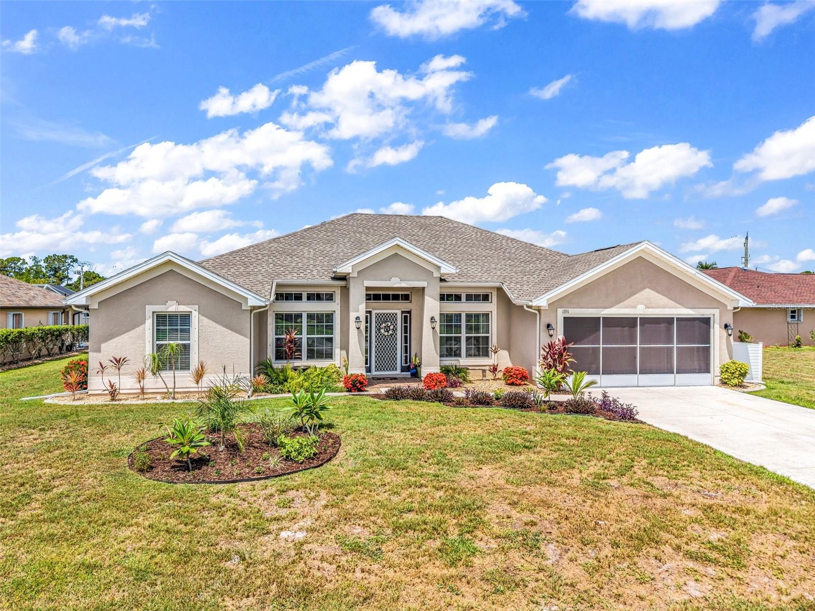 Welcome to this beautifully maintained 4-bedroom, 2-bathroom home offering 2,169 square feet of comfortable living space in the highly sought-after community of Deep Creek, where no flood insurance is required.  Step through the front door and you'll immediately appreciate the thoughtful layout. To the left is a versatile den, office, or art room, while a formal dining room is located to the right, just off the kitchen, perfect for hosting family gatherings and special occasions. The open-concept floor plan seamlessly connects the spacious living area to the eat-in kitchen, making entertaining effortless. The kitchen features a breakfast bar, closet pantry, and ample cabinetry and counter space for all your culinary needs- There's also a mini water heater under the sink for instant hot water!  The oversized primary suite is a private retreat with direct access to the lanai. The ensuite bathroom boasts dual sinks, a walk-in shower, private water closet, an impressive linen closet, and separate his-and-her walk-in closets providing exceptional storage. Designed with privacy in mind, the split-bedroom floor plan places the guest bedrooms on the opposite side of the home. The guest bathroom features a convenient tub/shower combination, and Bedroom #4 offers direct access to the lanai, making it ideal for guests, a home gym, or flex space. The lanai expands the full width of the house!  Additional highlights include an indoor laundry room complete with cabinets and countertop workspace, a tiled 2-car garage, full hurricane protection, and a new roof installed in 2023 for added peace of mind.  Situated on an oversized 11,525-square-foot lot, this property provides plenty of room to enjoy the Florida lifestyle. Conveniently located near shopping, dining, golf courses, parks, boating, medical, I-75, and the vibrant historic downtown area of Punta Gorda, this home offers the perfect combination of comfort, space, and location.  Schedule your private showing today and discover everything this exceptional Deep Creek home has to offer!