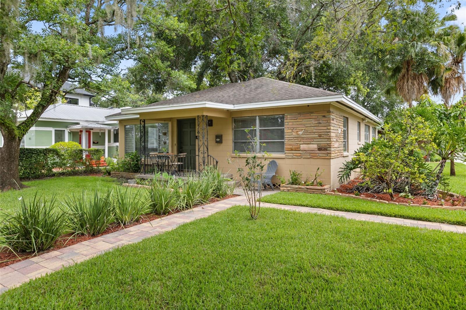 Situated in the heart of Thornton Park on a gorgeous corner lot, 821 E. Church Street offers a rare combination of historic charm and exceptional walkability. The main house features two bedrooms, two updated bathrooms, and a large multi-purpose utility room that can function as an appliance garage/laundry center/bike room/mudroom. Although it looks like a single-family home, there is also a separate 1-bedroom/1-bathroom cottage.  The cottage is spacious and updated with a full kitchen, and includes a dishwasher, a built-in microwave, and its own separate laundry closet.  This property also boasts a real downtown rarity – two covered parking spaces.  The roofed 480 sq. ft carport includes an exterior storage closet. This property offers several vignettes for outdoor living, including a welcoming front porch perfect for morning coffee, a paver side patio perfect for grilling, a sizable backyard fenced on two sides, updated landscaping, mango and lemon trees, and a beautiful canopy of majestic oak trees for shade. Nestled just minutes from Lake Eola and Thornton Park dining venues, you don’t have to fight for Sunday farmer’s market parking.  The downtown Orlando business, arts, and entertainment district offers one of Orlando's most desirable urban lifestyles and is just a short stroll away. This property offers exceptional flexibility: live in the home and have a separate guesthouse, or install a mother-in-law in the cottage for multi-generational living, or use the property as two rental units for long-term investment value.  Each home is separately metered and each has its own front and back doors.
This home is fortuitously located just outside of the historic district, giving it unlimited future potential without oversight of historic preservation’s cumbersome restrictions. Orlando’s most famous street is in transition, as can be seen by the new, large single-family homes constructed recently just a few doors down.