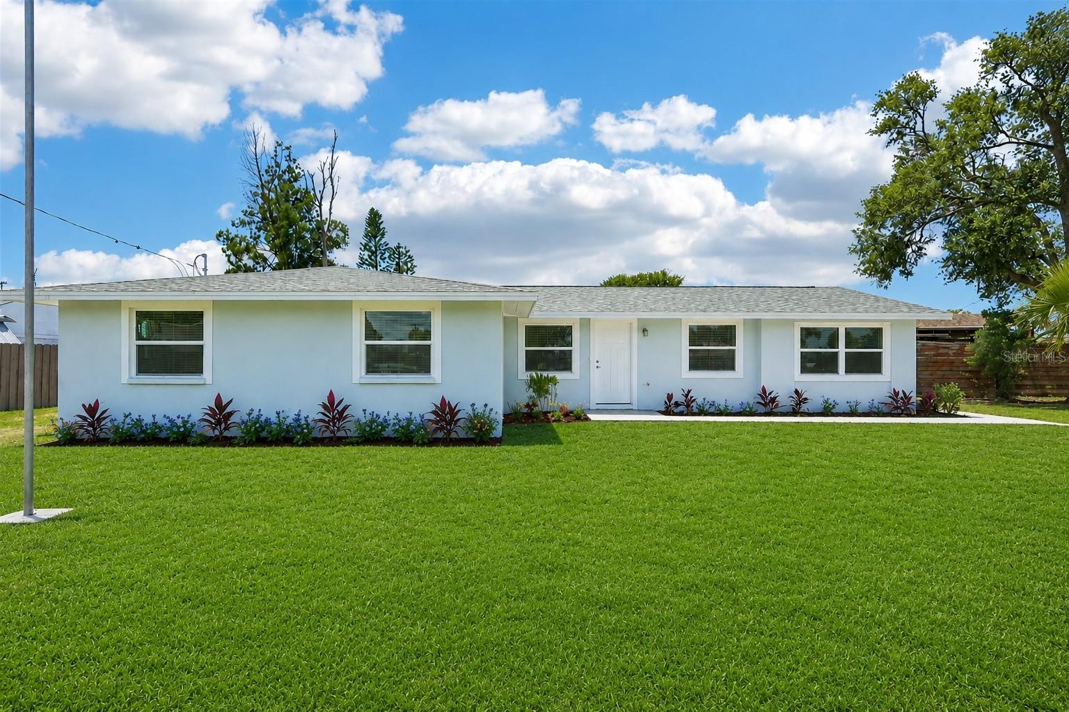 Virtually Staged. COMPLETELY RENOVATED WATERFRONT HOME IN THE HEART OF RUSKIN, OFFERING THE PERFECT BLEND OF MODERN LUXURY, ENERGY EFFICIENCY AND FLORIDA COASTAL LIVING. Situated on a nice-sized lot with room for RV/boat parking, this move-in-ready property has been upgraded from top to bottom, including a 2022 ROOF, COMPLETE ELECTRICAL REWIRE WITH A NEW PANEL, HIGH-EFFICIENCY HVAC SYSTEM, NEW WATER HEATER, IMPACT RATED WINDOWS AND DOORS, WITH ENHANCED INSULATION THROUGHOUT.  Inside, you'll find beautiful tile flooring throughout, all-new drywall with a Level 5 smooth finish, LED recessed lighting, fresh paint, and a stunning kitchen featuring REAL WOOD SOFT-CLOSE CABINETRY, QUARTZ COUNTERTOPS and a spacious walk-in pantry. Both bathrooms have been beautifully remodeled with quartz countertops, updated fixtures, and a frameless glass shower in the primary suite. Step outside and enjoy true waterfront living with a newly screened lanai, new concrete pavers, marine-grade dock decking, and an oversized storage shed (with power). Hurricane-impact windows and doors may qualify for insurance discounts.  The lot offers plenty of room to add a detached garage, workshop, or carport.  Located in the desirable waterfront community of Ruskin, you'll enjoy a relaxed coastal lifestyle with direct access to boating, fishing, kayaking, and some of Tampa Bay's best waterfront dining. Ruskin offers a unique combination of small-town charm and convenience, with easy access to downtown Tampa, St. Petersburg, Sarasota, and the Gulf beaches via I-75 and the Selmon Expressway. Spend your weekends exploring nearby nature preserves, marinas, golf courses, farmers markets, and parks, or enjoy fresh local seafood at nearby waterfront restaurants. With no need to sacrifice convenience for waterfront living, Ruskin continues to be one of the area's best values for those seeking an active Florida lifestyle.  This is a rare opportunity to own a fully renovated waterfront home where every major improvement has already been completed—simply move in, bring your boat, and start enjoying the Florida lifestyle.