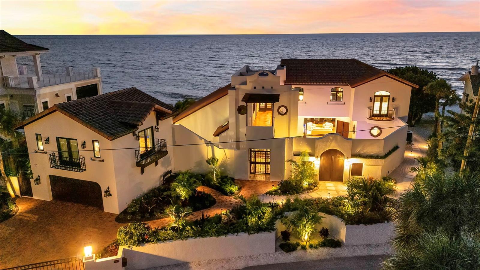 Gulf Front, private beach.  This sun-drenched Florida villa captures the character of a Mexican hacienda with the ease of tropical coastal living. Smooth stucco exteriors, clay tile roofing, and vibrant bougainvillea frame a private courtyard, setting the tone for a home that is both timeless and inviting.
Directly on the turquoise waters of the Gulf, this newly remodeled residence on the north end of Casey Key offers the rare privilege of a private beach just steps from the home. Set on one of Florida’s most exclusive barrier islands, the property enjoys sweeping sunset views, exceptional privacy, and convenient access to the dining, shopping, and cultural attractions of Venice and Sarasota.
Behind a gated entrance, the home features three bedrooms, a private office, and three-and-a-half baths, all thoughtfully updated to celebrate its extraordinary Gulf-front setting. Expansive windows and sliding glass doors frame breathtaking water views while filling the interiors with natural light and coastal breezes.
Rich architectural details reflect its hacienda-inspired design, including wood beams and moldings, barrel-brick ceilings, Mexican tile and wood floors, brick accents, artisanal mosaic tile, and hand-painted stair risers. Hurricane-impact windows and doors, a new roof, a new pool, and updated air-conditioning and pool equipment provide both peace of mind and modern comfort.
The gourmet kitchen is beautifully appointed with custom cabinetry and Wolf appliances, creating an ideal setting for entertaining after a day on the beach. The primary suite is a private retreat with a sitting room, wet bar, soaking tub, walk-in closet, and private balcony overlooking the Gulf. Two additional en-suite guest bedrooms provide comfort and privacy for family and visitors.
A spiral staircase leads to the rooftop deck, where panoramic views stretch from the Gulf to the Intracoastal Waterway. Outside, the courtyard-style pool, fountain, tiled terraces, and lush tropical gardens create a tranquil setting for authentic alfresco living.
This is an exceptional opportunity to experience the privacy, beauty, and effortless lifestyle of Gulf-front living on Casey Key.