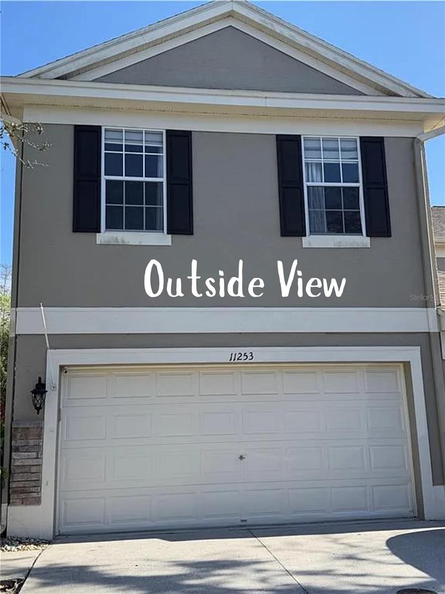 Welcome to this beautifully maintained end-unit townhome in the highly desirable Windsor Place at Westchase. Backing to a peaceful conservation area, this bright home offers tranquil views from both the living room and patio, creating the perfect blend of charm, comfort, and convenience in a maintenance-free community. This spacious layout features 2 large bedrooms, a huge loft, 2.5 bathrooms, and a 2-car garage. The first floor includes an open living and kitchen area with stainless steel appliances and easy garage access for everyday convenience. Upstairs, the bedrooms are thoughtfully positioned on opposite sides for added privacy, with a generous loft in between—ideal for a home office, playroom, media room, or flex space. A screened porch makes entertaining easy and offers a relaxing retreat for morning coffee or evening unwinding. The garage is a standout with ample storage, including 4 overhead racks plus additional cupboards/cabinetry, providing exceptional space for tools, seasonal décor, sports gear, and more. Residents enjoy access to the community pool, top-rated schools, and close proximity to shopping, dining, and major commuter routes. Don’t miss this opportunity to own a move-in-ready townhome in one of Westchase’s most sought-after locations.