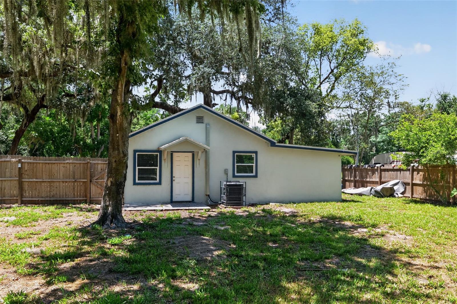 Below appraisal value! Situated on almost half an acre of Private land backing up to a preserve type water large multi acre feature giving a feel of endless nature paradise. Mature Gorgeous Oak Trees welcome you to an updated and renovated cozy retreat nestled near the charming downtown of Groveland, situated in the picturesque landscape of Lake County. This quaint but tastefully decorated 3-bedroom, 2-bathroom home embodies the allure of small-town living, offering a perfect canvas for your vision and creativity. Step inside to discover a warm and inviting atmosphere, with an open living space that radiates potential. Beyond the inviting interior lies a spacious plot of land, providing ample room for outdoor activities, gardening, or potential expansion. Located near downtown Groveland, residents can revel in the ease of access to local shops, dining venues, and community events, fostering a true sense of belonging within this tight-knit community. Lake County's breathtaking natural beauty surrounds this property, offering scenic views and an abundance of outdoor adventures, from hiking trails to serene lakeshores, inviting residents to explore and immerse themselves in nature's embrace.