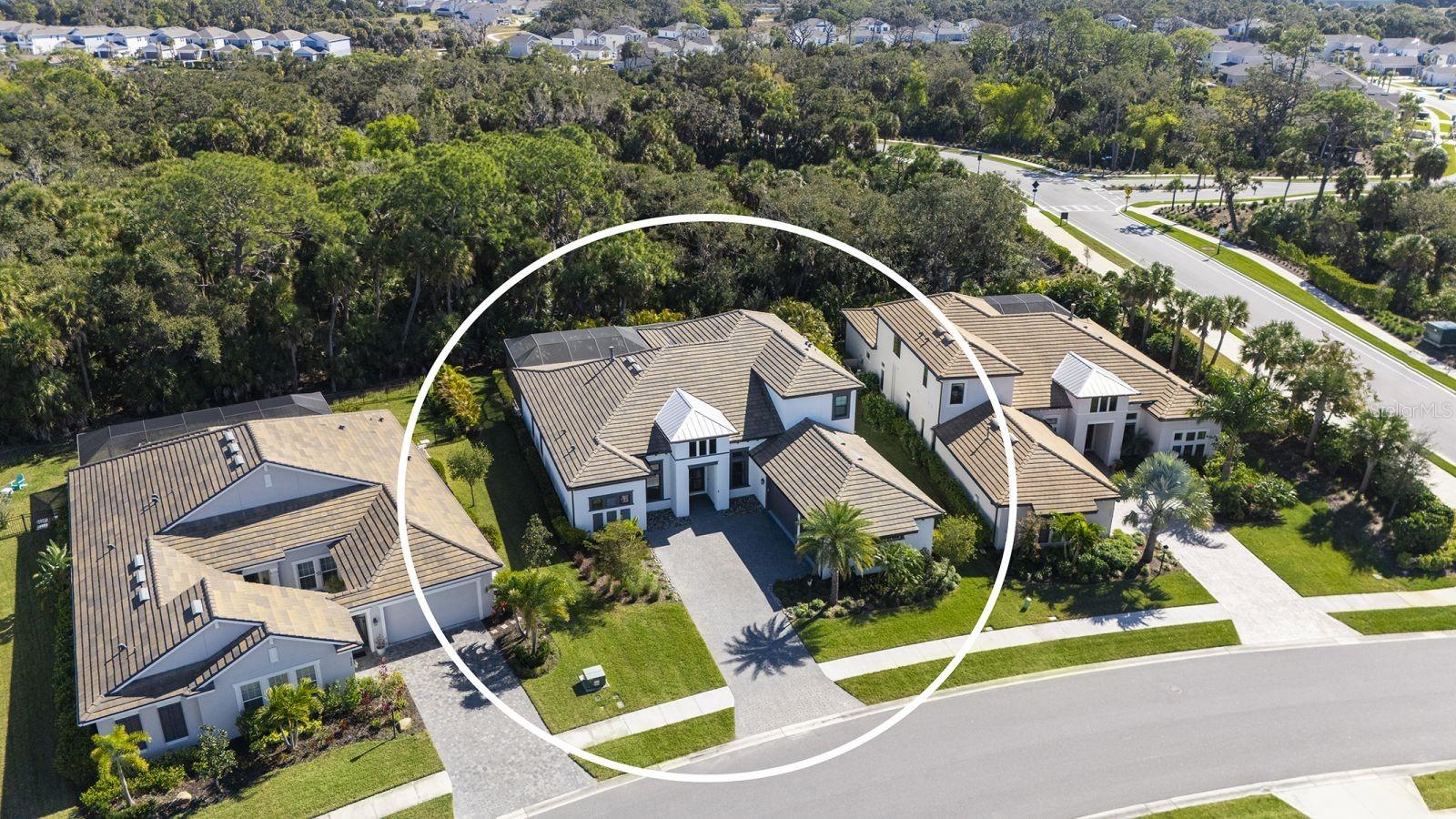 Experience elevated living in the highly sought-after Skye Ranch community of Sarasota. Perfectly positioned on Starry Night Avenue, this expanded Beacon Model offers an impressive 4,877 square feet under air across two thoughtfully designed levels, showcasing refined finishes, extensive upgrades, and exceptional attention to detail throughout. Meticulously maintained and beautifully appointed, this four-bedroom residence features four full baths and two half baths, including three private ensuite bedrooms and a fourth bedroom with Jack-and-Jill bath access. The main living areas are enhanced by soaring ceilings, elegant flooring, and expansive open spaces designed for both everyday comfort and effortless entertaining. At the heart of the home, the gourmet kitchen is a culinary showpiece, appointed with a Monogram six-burner gas range top with pot filler, double dishwashers, a separate beverage refrigerator with pass-through to the formal dining room, a generous quartz-topped island with touchless faucet, walk-in pantry, and a casual dining area overlooking the stunning outdoor living space. The main level also offers a private office and dedicated media room, providing flexibility for work, relaxation, or recreation.  The spacious primary suite provides the perfect retreat to unwind, offering direct access to the lanai and pool area.  Your private retreat area is complimented by two custom walk-in closets and a spa-inspired bath designed for relaxation.  Upstairs, the second level is ideal for guests or multigenerational living, featuring a spacious bonus room with wet bar, beverage refrigerator, dishwasher, half bath, and a private ensuite bedroom. Outdoor living is truly resort-inspired. The expansive lanai with travertine flooring frames a graciously sized pool and spa with built-in waterfall, firepit, and sunshelf. A fully equipped summer kitchen and serene preserve views create a private, tranquil setting perfect for entertaining or relaxing year-round. Additional highlights include a spacious laundry room and a three-car garage offering ample storage. Ideally located near The HUB Amenity Center and the new Skye Ranch School, residents enjoy access to exceptional community amenities including a resort-style pool, fitness center, clubhouse, café, dog park, scenic trails, sports courts, playgrounds, and a vibrant calendar of events. Convenient to I-75, shopping, dining, and Sarasota’s renowned Gulf Coast beaches. A remarkable opportunity to embrace refined Florida living in one of Sarasota’s most desirable communities.