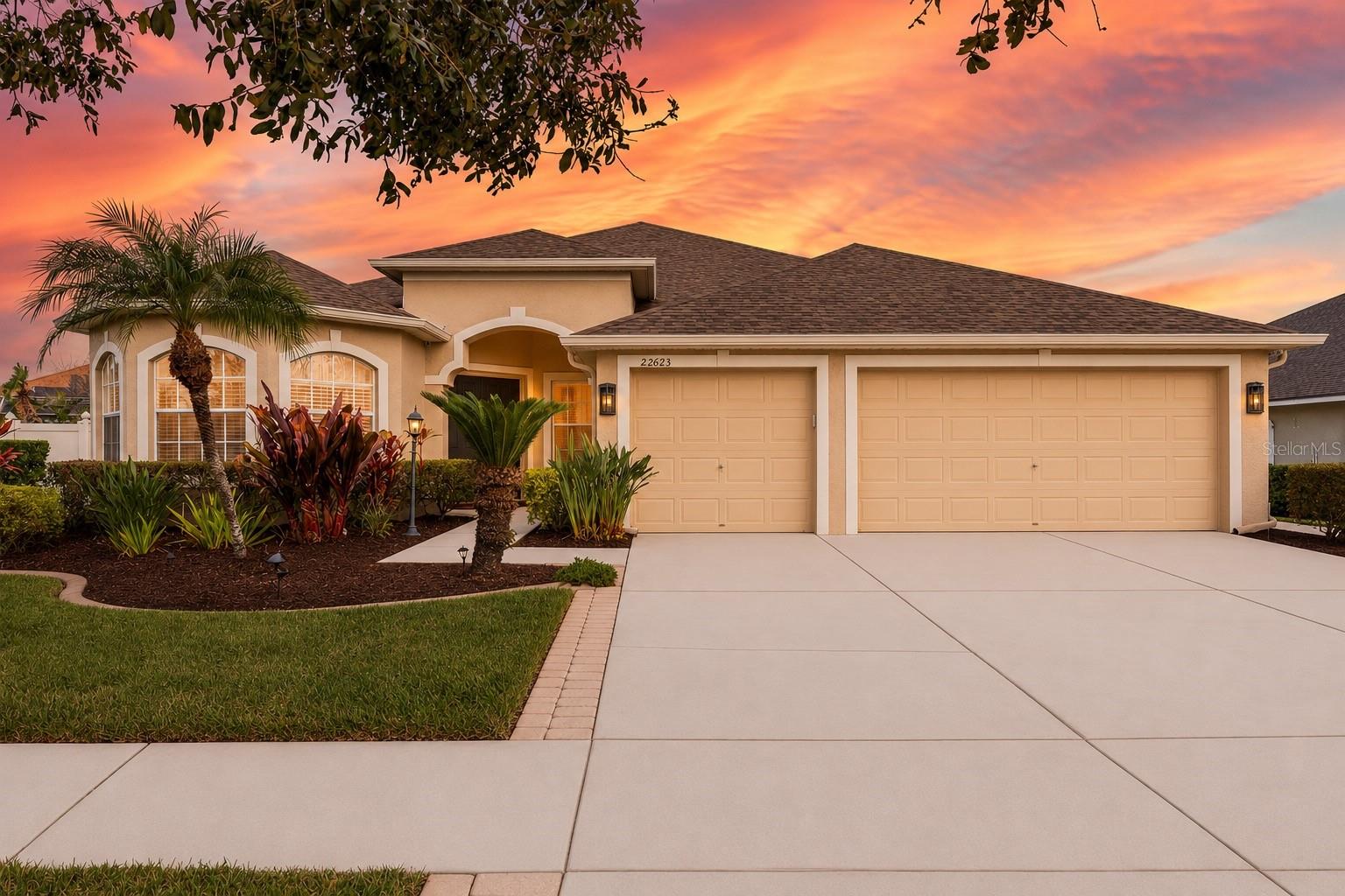 Short Sale. Welcome to this spacious 4-bedroom, 3-bathroom pool home located within the gated community of Valencia Gardens in Land O' Lakes. Situated on a 0.25-acre homesite, this two-story residence offers over 3,000 square feet of living space with a versatile layout designed for today's lifestyle.All four bedrooms are conveniently located on the main floor, while the expansive upstairs bonus room provides the perfect space for a home theater, game room, office, or additional living area. The kitchen features granite countertops, stainless steel appliances, ample cabinet space, and overlooks the main living areas, making it ideal for both everyday living and entertaining. Step outside to your private backyard retreat featuring a screened pool enclosure, saltwater pool, and vinyl fencing for added privacy. Whether hosting gatherings or enjoying a quiet evening at home, this outdoor space is designed to be enjoyed year-round. Additional features include a 3-car garage, with one bay currently configured as a home gym, smart WiFi-connected irrigation, and a roof replaced in 2022. The community's lakes are now approved for fishing, adding another recreational amenity to this neighborhood. Conveniently located near shopping, dining, schools, and major commuter routes, this home offers the space, privacy, and flexibility you've been looking for.