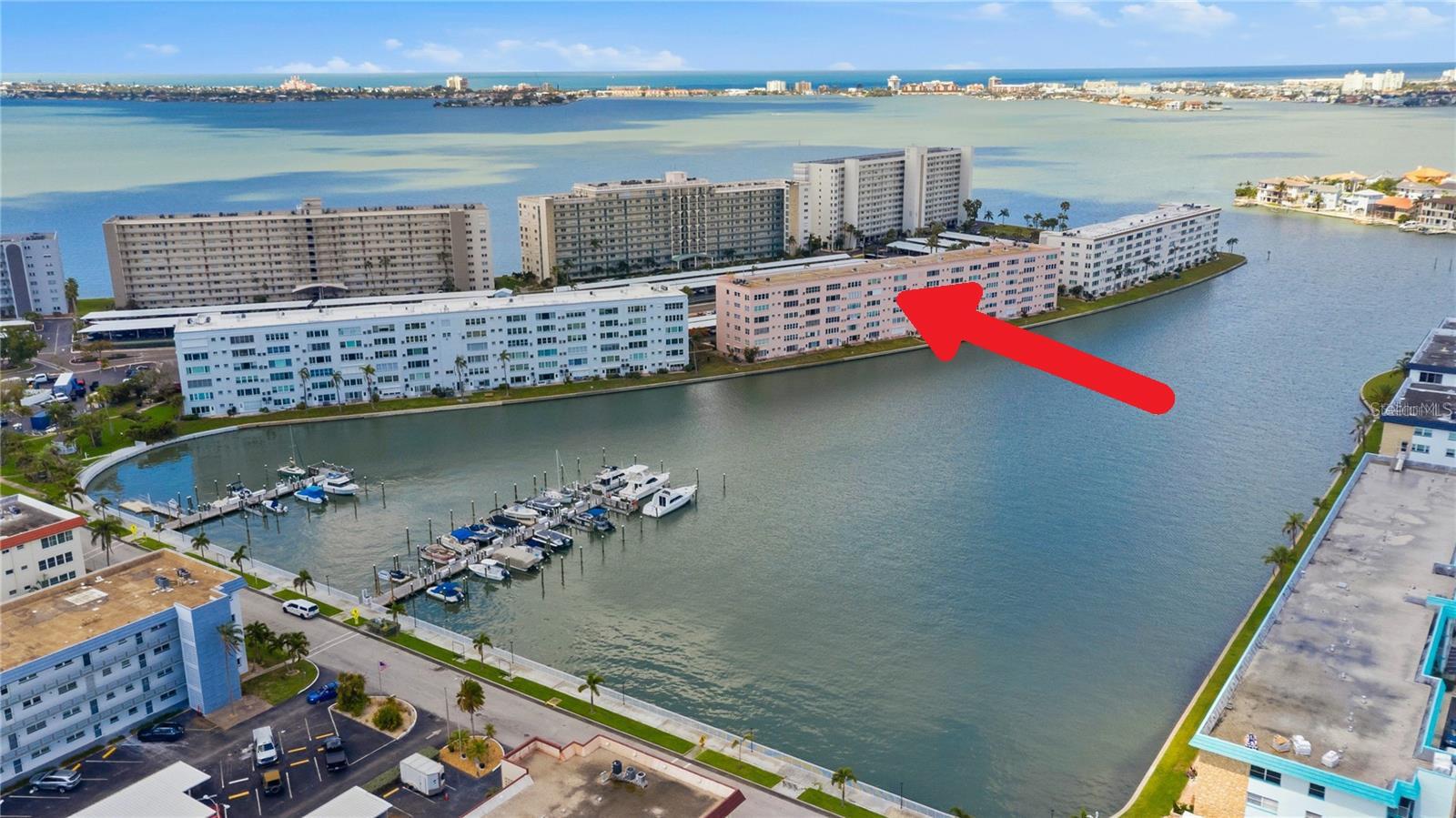 Welcome to the highly sought-after Manchester Building in the waterfront community of Town Shores, located along beautiful Boca Ciega Bay. This 4th-floor, turnkey 2-bedroom, 2-bath condo offers sweeping views of the community waterways, boat slips and adjacent Pasadena Yacht & Country Club. Inside, you’ll find an updated kitchen featuring newer stainless-steel appliances, upgraded cabinetry with soft-close drawers, granite countertops, and accent lighting. Additional improvements include updated electrical outlets and rocker switches, rich vinyl plank flooring, and PGT impact windows throughout. Covered parking is included, along with secure bicycle and kayak storage. 
Residents of Town Shores enjoy resort-style amenities, including four heated pools, tennis and pickleball courts, a marina, shuffleboard courts, and a multi-purpose clubhouse complete with billiards, card room and an art studio.
Just a short walk away is the vibrant Gulfport Beach Art & Entertainment District, known for its charming Key West vibe, local restaurants, galleries, and year-round events such as the Tuesday Fresh Market, monthly Art Walk and the popular Gecko Fest. Only 10 minutes to the famous St. Pete Pier or award-winning St. Pete Beach. 
Additional conveniences include on-site laundry and extra storage within the building. The monthly HOA fee covers water, sewer, trash and recycling, cable, internet and gas, leaving residents responsible only for electricity. The Manchester Building has already passed its milestone inspection and offers some of the lowest HOA fees in the community. Furnishings and décor are negotiable. This is a 55+ community. Easy to show, so call today!
