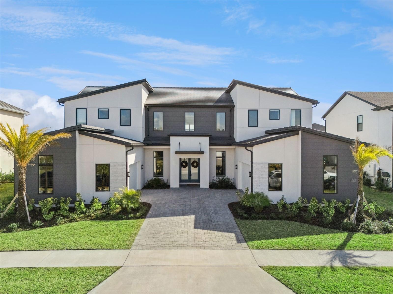 Welcome to refined luxury living at 9320 Laurel Berry Drive, an elegant contemporary residence designed for both sophistication and comfort. This stunning home showcases striking modern architecture, clean lines, and exceptional curb appeal, complemented by professional landscaping and a welcoming private entry.

Inside, the residence offers expansive living spaces filled with natural light, high ceilings, and premium finishes throughout. The thoughtfully designed floor plan provides seamless flow for entertaining and everyday living, featuring spacious bedrooms, spa-inspired bathrooms, and designer details that elevate every room.

The gourmet kitchen serves as the heart of the home, ideal for hosting and culinary enjoyment, while the open-concept living areas extend effortlessly to the outdoors. Located in a highly desirable community, this property offers convenience to top-rated schools, dining, shopping, and major roadways, all while maintaining a sense of privacy and exclusivity.

A rare opportunity to own a modern luxury home where style, comfort, and location come together seamlessly. Schedule your private showing today.