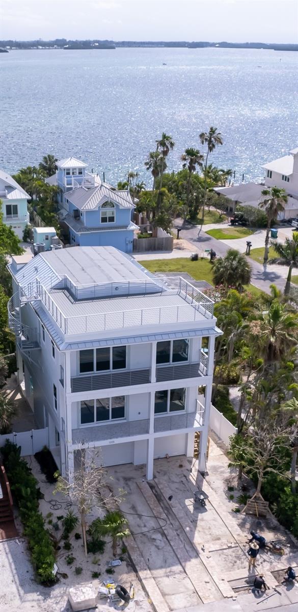 short stories""... One of the best vacation desinations in the United States...!!! The key is the home to be built ..model to look  one block away...at that is 3 years old with track record of income.....these are the real numbers ..Excellent opportunity to own a cleared and build-ready lot on beautiful Bradenton Beach, just 150 feet from the sparkling waters of the Gulf of America beach.  Offered at $1,106,000, this prime vacant lot is perfectly positioned to build an extraordinary custom vacation rental investment or private coastal retreat.  Proposed plans accommodate an impressive 5 bedroom, 5 bath luxury residence complete with a private pool, jacuzzi, and rooftop deck designed to capture breathtaking island sunsets and water views.   Estimated construction cost is approximately $2,769,219 for everything.lot included .. Ideally situated between the Gulf of America and the expansive Sarasota Bay, this location offers the ultimate island lifestyle including beach walks, bicycling, kayaking, boating, fishing, and more.  Enjoy convenient access to downtown Bradenton Beach 3-4 blocks away..Bridge Tenders..Drift Inn..Moose Club.., boutique shopping, entertainment.  Rental projections and  income  information  available .Do not walk the property without listing agent present.