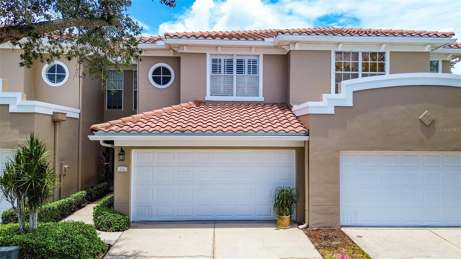 TOWNHOME IN PRIME ST PETERSBURG LOCATION with NO REAR NEIGHBORS in GATED COMMUNITY! Highly sought-after Villas of Carillon, a private GATED COMMUNITY nestled in the heart of vibrant Carillon Park known for its beautifully maintained grounds, walkable setting and unbeatable proximity to downtown St. Pete, Tampa, and the area’s top dining, shopping, and the recently opened Top Golf entertainment venue. Residents enjoy RESORT-STYLE AMENITIES including a COMMUNITY POOL and clubhouse perfect for relaxing and social gatherings. Backing to LUSH PRESERVE VIEWS, this immaculate unit offers exceptional privacy and has been meticulously maintained. Inside, you’ll find a spacious OPEN CONCEPT FLOOR PLAN enhanced by HIGH CEILINGS adorned with CROWN MOLDING, plantation shutters, and ELEGANT CUSTOM WOODWORK. Double French doors from the living area open to a private screened lanai, creating the ideal spot to enjoy your morning coffee or unwind in the evenings while overlooking the peaceful wooded views and natural surroundings. A half bath on the main level adds convenience for guests. WOOD-LOOK PLANT FLOORING throughout the downstairs creates a seamless look, while the solid wood staircase leads to hardwood flooring on the upper level. The spacious kitchen features custom cabinetry, crown molding, plenty of GRANITE COUNTERTOPS for meal prep, beautiful tile backsplash, stainless steel appliances and breakfast bar seating—perfect for casual dining and entertaining. The kitchen opens to the great room which offers an open layout ideal for both everyday living and entertaining. All three large bedrooms are privately situated upstairs, creating separation between the living and sleeping spaces. The main suite has private access to a JULIET BALCONY WITH FRENCH DOORS in the bedroom that allow for lots of natural light and views of the private conservation, a large walk-in closet and private ensuite bath with double vanity, soaking tub and separate walk-in shower with glass tile accent wall. Two guest bedrooms, each with walk-in closets share a convenient Jack-and-Jill bathroom with granite countertop, and beautiful custom tile flooring. The 2nd floor laundry room and included washer and dryer are conveniently located near the bedrooms. HVAC system installed 2020. The REFINISHED UPSTAIRS BALCONY and downstairs patio provide ADDITIONAL OUTDOOR LIVING SPACE, along with a storage closet and conservation views. NO FLOODING OR POWER LOSS was experienced during any hurricane events. Residents of Villas of Carillon enjoy a Private Gated Entry with 24 hour patrolling for added peace of mind, and RESORT-STYLE LIFESTYLE with access to a heated pool, clubhouse for parties, scenic ponds, and beautifully lit walking paths. Enjoy true maintenance-free living in this gated, PET-FRIENDLY COMMUNITY. THE HOA FEE COVERS SO MANY THINGS including water, sewer, trash, exterior maintenance, grounds and landscaping, pest control, community pool maintenance, recreational facilities, security gate, escrow reserves, and homeowner and flood insurance. Rentals are permitted immediately after purchase with HOA approval. The community allows two pets with no size limit. PERFECTLY POSITIONED BETWEEN DOWNTOWN ST PETERSBURG & DOWNTOWN TAMPA this prime location also offers convenient access to two international airports as well as the award-winning Gulf beaches. Come live the St. Petersburg lifestyle in carefree luxury living in one of the area’s most sought-after Gated communities!