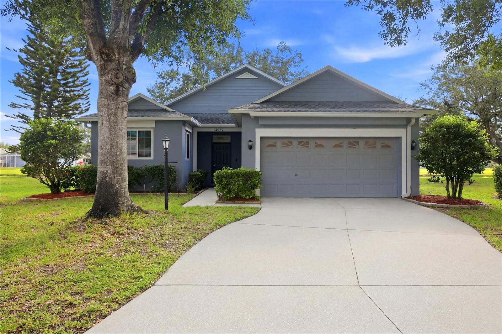 Welcome home to this thoughtfully upgraded 3-bedroom, 2-bath residence featuring a versatile bonus room and high-end ceramic tile flooring throughout. Conveniently located within minutes of grocery stores, restaurants, and everyday services, you'll also enjoy easy access to I-75 and University Parkway in approximately 10 minutes, with the Gulf Coast's renowned beaches just 35 minutes away.

What truly sets this home apart is the incredible attention to detail and functionality throughout. The kitchen has been extensively customized with a focus on storage, organization, and everyday convenience. Expanded countertops provide abundant workspace while still leaving plenty of room for small appliances. Custom tongue-and-groove hardwood cabinetry offers storage solutions rarely found in this price range, including built-in spice racks, knife storage, and a dedicated cookbook holder.

Cooking enthusiasts will appreciate the natural gas cooktop with pot filler, built-in French door oven, second built-in wall oven, drawer-style microwave, and innovative double-drawer dishwasher that allows each drawer to operate independently. Additional custom features include integrated RGBW lighting at the floor, countertop, and upper cabinet levels, as well as a built-in mixer lift constructed with matching granite from the countertops for seamless appearance and convenience.

The primary suite features an updated ensuite bathroom with dual sinks, custom cabinetry with extensive drawer storage, a dedicated makeup station, and a tiled glass shower. Two additional bedrooms and a flexible bonus room provide space for guests, a home office, hobby room, or additional living area depending on your needs.

Outdoor living is equally impressive. The screened lanai has been designed to maximize enjoyment of Florida's year-round weather and includes a tiled patio, three-person hot tub, and Napoleon gourmet grill connected directly to the home's natural gas supply. The lanai is also equipped with electricity, water, and natural gas connections, creating a highly functional outdoor living and entertaining space.

From the custom kitchen features and extensive storage solutions to the upgraded outdoor living areas, this home offers a level of craftsmanship and functionality that is difficult to find. Combined with a convenient location near shopping, dining, major commuting routes, and Gulf Coast beaches, this property delivers exceptional value and features rarely found in this market.