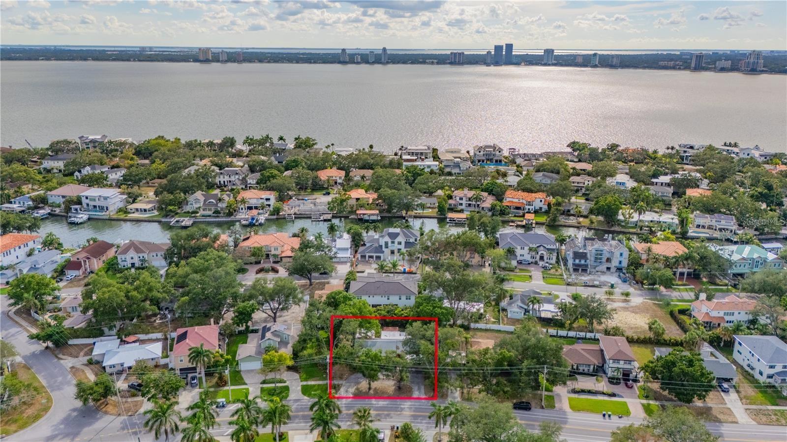 An exceptional opportunity to create your dream estate on an oversized double lot measuring 105' x 113' (.27 acres) in the heart of prestigious Davis Islands, one of South Tampa's most coveted neighborhoods. The existing home sustained damage from Hurricane Helene, presenting a rare blank canvas to design and build a custom residence tailored to your vision. The expansive homesite provides ample space for a sprawling luxury home, resort-style pool, guest house, and generous outdoor living and entertaining areas—an increasingly rare offering in South Tampa. Enjoy the unmatched Davis Islands lifestyle with charming shops, restaurants, Tampa General Hospital, and the vibrant village center just a short walk, bike ride, or golf cart ride away. Located only minutes from Downtown Tampa, Water Street, Channelside, and premier sports and entertainment venues, residents also enjoy exclusive amenities including a beach, marina, yacht club, parks, tennis courts, community pool, and private airport. This is a rare opportunity to secure one of the area's larger homesites and build a legacy property in one of Tampa Bay's most iconic and desirable waterfront communities.