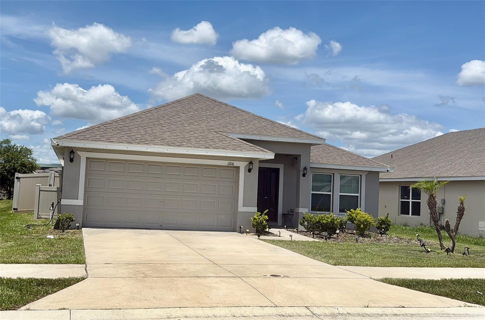Welcome to this stunning 2,237 sq ft home, featuring four spacious bedrooms and three full bathrooms designed with an open floor concept perfect for modern living. The heart of the home is the beautifully appointed kitchen, showcasing 36-inch wood cabinets with crown molding, an elegant backsplash, and a functional island that doubles as a breakfast bar. Enjoy cooking with all stainless steel appliances, including an upgraded refrigerator, while benefiting from the in-wall TAEXX Pest Control system for peace of mind.

Entertain in style with a formal dining room that seamlessly connects to the family room, creating an inviting atmosphere. Say goodbye to carpets as this home boasts ceramic tile throughout, including the bathrooms and closets, while all bedrooms feature luxury vinyl flooring for easy maintenance.
All bedrooms have walk-in closets. They also have upgraded blackout blinds sun/light protection for convenience.  Windows and doors with RING security system. All windows are double pane for years of peace of mind. The primary bedroom is of ample size and have its own en suite bathroom. Two full vanities for his/hers, linen closet, relaxing garden bath and separate shower with elegant glass door. 
The laundry room leads to a two-car garage equipped with a remote control garage door for convenience. Step outside the french doors to discover a unique screened back porch that opens to a fully vinyl-fenced backyard. A newly added full concrete floor ensures the backyard is level, providing ample space for gatherings and outdoor entertainment. The sides of the house are embellished with sandy and square stepping stones for easy maintenance. 
Located near a variety of dining options, national restaurant brands, and grocery stores, this home is just 18 minutes from Port 27, a hidden gem known for its food, boutique shops, and family-friendly atmosphere. Enjoy easy access to Walt Disney parks and the beautiful beaches of Tampa, making this location ideal for leisure and fun.

Don’t miss out on this incredible opportunity to own a move-in ready home! Schedule your private showing today!
