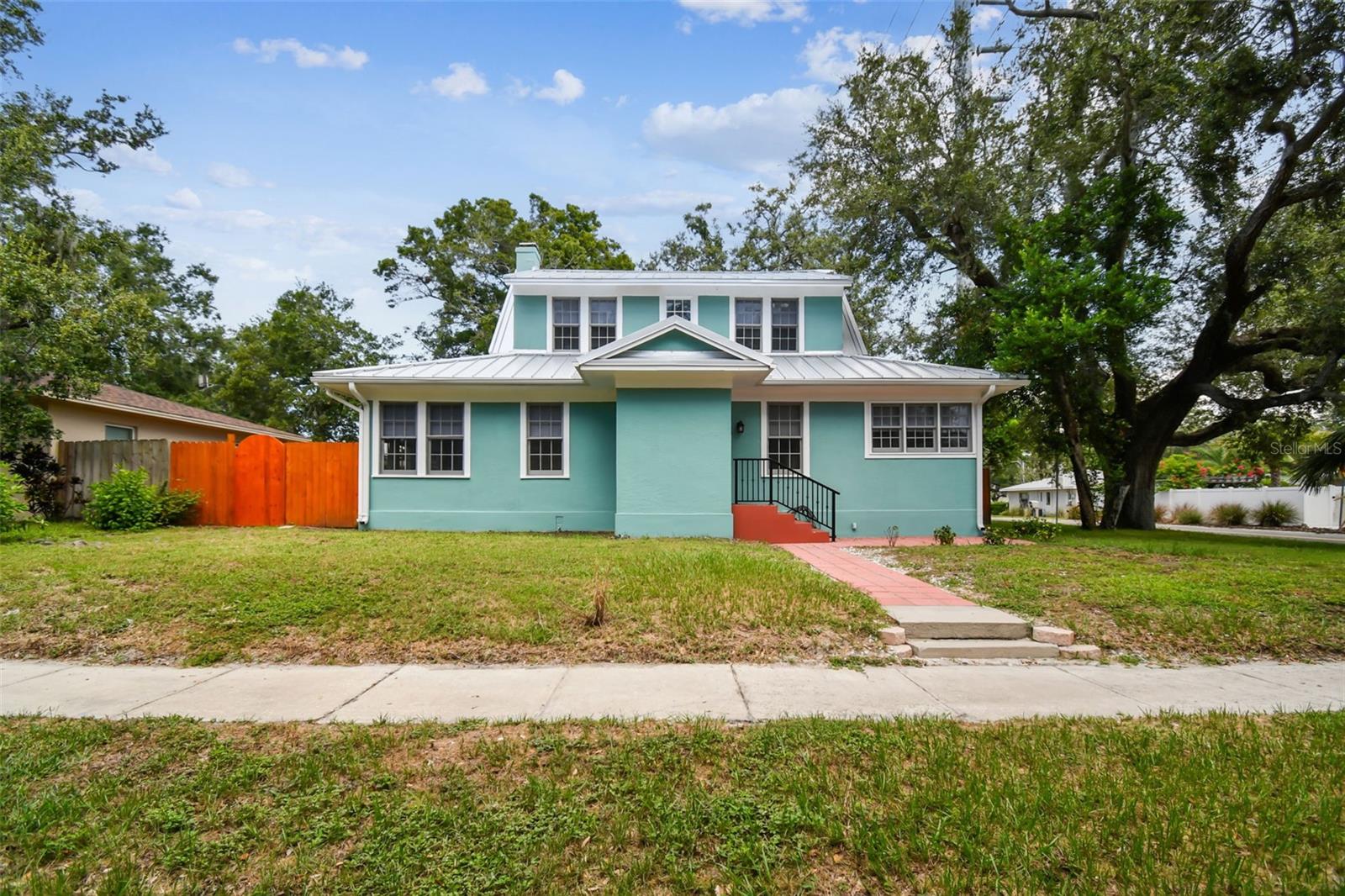 New Price for this is a beautiful historic home 758 Wood Str. in Downtown Dunedin.  Features new metal roof, appliances, new ac duct work, fresh paint, fans, refinished wood floors, down stairs, vinyl floors up stairs, updated bathrooms, bidets in all bathrooms, granite counter tops, wood fireplace as is , big deck, fully fenced yard with mature landscaping, almost a quarter acre of buildable lot. You can add on as well as 2 car garage with garage apt, or build a duplex or 2 separate dwellings. Many options available to the next buyer. Location is prime close to Downtown, Hospital, Restaurants, Shops, Schools, Blue Jays Stadium, Pinellas Trail, Water and much more. Agent is related to Owner, This is an AS IS purchase.  Beauty Prime Location!
High and Dry for past Storms.