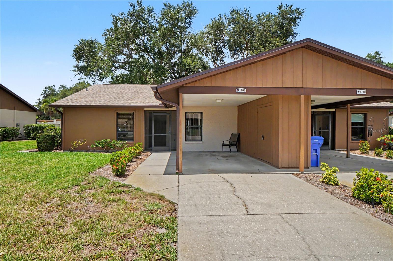 Well-maintained 2-bedroom, 2-bath villa located in a desirable 55+ community offering comfortable, low-maintenance living. This spacious home features an open floor plan with soaring cathedral ceilings that create a bright and airy feel throughout the main living areas. Relax and enjoy the screened-in porch, perfect for morning coffee or evening breezes. Recent updates include a new roof (2024), new electrical panel, and new gutters with leaf guards for added peace of mind. Hurricane shutters provide extra protection and convenience. The home also includes a covered carport and access to the community pool, making it easy to enjoy the Florida lifestyle year-round. All information is believed to be accurate & should be verified by the buyer.