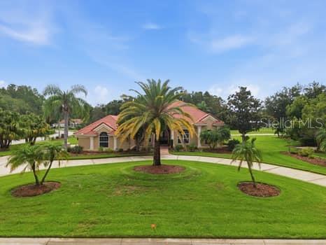 Welcome to luxury living in the highly sought-after, guard-gated Cheval East community! Perfectly positioned on over a ½ acre overlooking the 4th hole of Cheval Golf & Country Club, this beautifully remodeled residence offers an exceptional blend of timeless elegance, thoughtful design, and resort-style outdoor living.

Featuring 4 bedrooms, 3.5 bathrooms, this thoughtfully designed split floor plan offers both privacy and flexibility. The private primary suite is a true retreat, featuring a luxurious spa-inspired bath with two custom walk-in closets, separate his-and-her vanities, a relaxing soaking tub, and an oversized walk-in shower. Two secondary bedrooms are located off the spacious family room, with one offering an en suite bath and the other conveniently located adjacent to a full hallway bathroom. A fourth bedroom at the front of the home is currently being used as an office, making it ideal as a private workspace, guest room, or bedroom.

At the heart of the home is the beautifully remodeled chef’s kitchen featuring rich dark wood cabinetry, a premium Sub-Zero refrigerator (2025), Bosch dishwasher (2025), designer tile backsplash, luxurious high-end granite countertops, a 6-burner gas cooktop, separate built-in oven, and microwave. The kitchen opens to a spacious family room highlighted by a cozy gas fireplace, creating the perfect gathering space for family and friends.

The home also features an elegant formal living room and large formal dining room, offering beautiful spaces for entertaining and hosting holidays or special occasions.

Designed with both luxury and functionality in mind, the home includes a beautifully RENOVATED LAUNDRY ROOM (2025)with quartz countertops, abundant CUSTOM cabinetry and NEW WASHER/DRYER, an oversized butler’s pantry (2025), and a CUSTOM FAMILY DROP ZONE with additional built-in storage refrigerator, wine refrigerator with quartz counters(2025) . Every bathroom is appointed with premium TOTO toilets, reflecting the home’s commitment to quality throughout.

Step outside to your own private backyard oasis. The beautiful travertine paver lanai surrounds the resurfaced Pebble Tec pool accented by a decorative outdoor fountain. The spectacular outdoor living area is an entertainer’s dream, featuring a built-in Alfresco grill, granite countertops, bar seating, a 60,000 BTU wok burner, and a remote-controlled aluminum pergola that provides shade at the touch of a button for year round entertaining (2025).

Additional improvements include a TILE ROOF (2013) and TWO NEW HVAC systems (2024), providing peace of mind and lasting value.

Located within the highly sought-after Steinbrenner High School District, Cheval is one of Tampa Bay’s premier gated communities, known for its mature oak-lined streets, scenic golf course views, and exceptional lifestyle. Residents have the opportunity to join the Cheval Athletic Club, Cheval Golf Club, and enjoy access to the renowned TPC Tampa Bay Golf Course through optional memberships available for an additional fee.

Ideally located near upscale shopping, dining, medical facilities, and major highways, this exceptional residence offers the perfect combination of luxury, comfort, and one of Tampa Bay’s most desirable addresses.