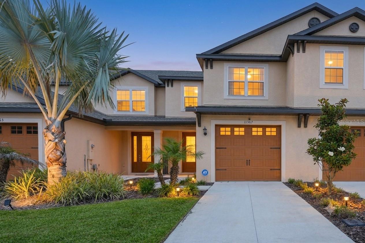 Model-Home Style Living in Mirada Lagoon Community – Furnishings Available for Purchase
Welcome to Mirada! If you’ve ever dreamed of owning a model-home-style residence without the wait of new construction, this is your opportunity.
Built in 2022, this stunning two-story home offers approximately 1,856 square feet of beautifully designed living space and is truly turnkey and move-in ready. From the moment you step inside, you’ll appreciate the soaring ceilings, open-concept layout, ceramic tile flooring, and thoughtfully selected décor that create a bright, elegant, and inviting atmosphere.
The home’s carefully curated furnishings and décor have been designed to complement the space beautifully and may be purchased separately, offering buyers the unique opportunity to enjoy a fully furnished, move-in-ready experience with minimal effort.
The spacious floor plan is ideal for both everyday living and entertaining, featuring modern finishes, generous living areas, and seamless indoor-outdoor living with screened and open porch spaces perfect for enjoying Florida’s year-round sunshine. Built with durable concrete block construction and meticulously maintained, this home offers exceptional curb appeal and peace of mind.
Located in the highly sought-after Mirada community, residents enjoy access to the world-famous Mirada Lagoon—a crystal-clear, resort-style lagoon featuring swimming, kayaking, paddleboarding, sandy beach areas, cabanas, waterslides, playgrounds, walking trails, dog parks, and golf cart-friendly streets. The community hosts year-round events and activities that create a true vacation-inspired lifestyle.
Conveniently located near Kirkland Ranch K-12, San Antonio Elementary School, Pasco Middle School, and Pasco High School, as well as shopping, dining, and major highways, this home combines luxury living with everyday convenience.
Whether you’re looking for a primary residence, seasonal retreat, or an effortless turnkey opportunity, this beautifully maintained home offers a rare chance to move right in and start enjoying everything Mirada has to offer from day one.