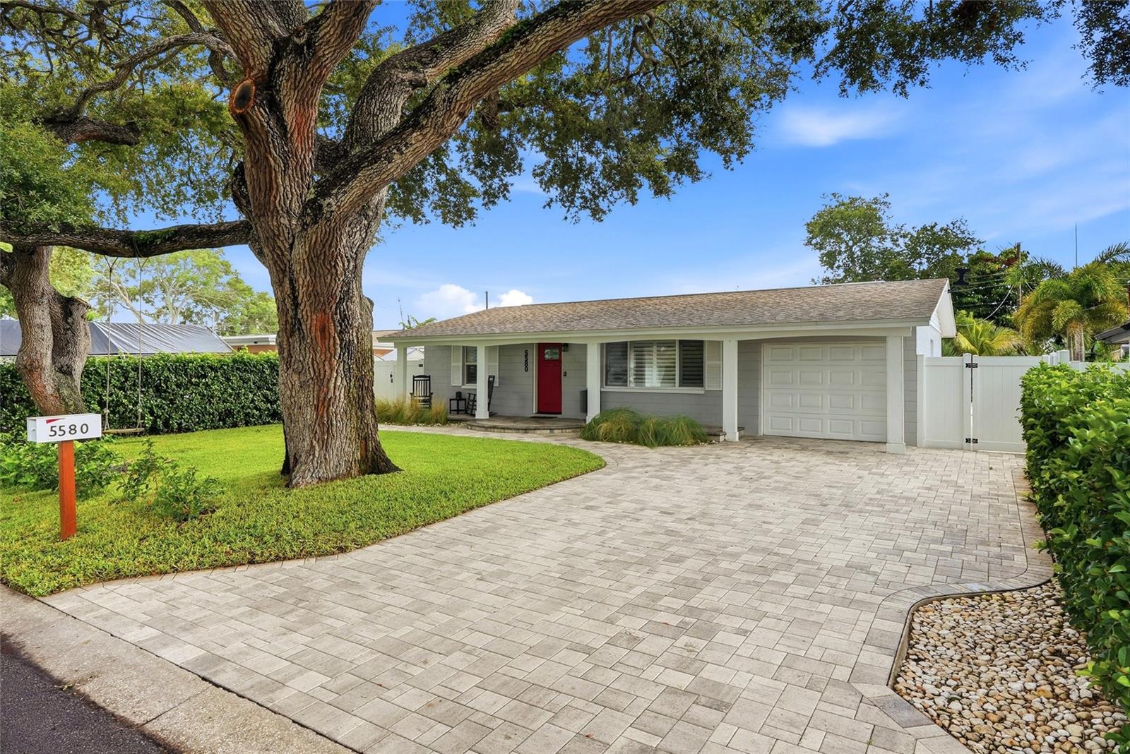Welcome to your own PRIVATE TROPICAL OASIS—an impeccably maintained 3-bedroom, 2-bath POOL home in a NON-FLOOD and NON-EVACUATION zone, yet just five minutes from the white sands of Madeira Beach. From the lush lawn and pristine paver driveway to the welcoming front porch, PRIDE OF OWNERSHIP is evident at every turn.

Inside, the light-filled, OPEN CONCEPT floor plan creates an effortless flow for everyday living and entertaining. Ceramic tile flooring, Plantation Shutters, Crown Molding, 4.5-inch baseboards and recessed lighting add style and continuity throughout. The kitchen opens to the main living area and features GRANITE countertops, stainless-steel appliances, solid wood cabinetry and an expansive BREAKFAST BAR - perfect for morning coffee, casual meals and conversation.

A SPLIT BEDROOM layout provides added privacy, while the generously sized primary suite offers plenty of space for a sitting area or home office. 

The oversized family room adds exceptional FLEXIBILITY and can easily accommodate dining, recreation, fitness, media or work-from-home needs.

Step outside and discover the true showcase: a LOW-MAINTENANCE tropical oasis designed for enjoying the Florida lifestyle. The NEW saltwater POOL and heated spillover spa feature color-changing LED lights, creating a spectacular setting from sunny afternoons to evening swims. An expansive paver patio, tropical landscaping and permitted firepit provide multiple spaces for lounging, dining and gathering under the stars. Three custom storage sheds—two with electricity—offer outstanding storage and exciting possibilities for a workshop, She Shed or pool cabana.

Additional peace-of-mind features include a whole-house GENERATOR with transfer switch and propane connection, DOUBLE-PANE thermal windows, new IMPACT-rated front and rear doors, pre-cut plywood panels with easy to install clips, newer ductwork and insulation, new irrigation well pump, and a beautifully finished garage with epoxy flooring, A/C, new double utility sink and pull down attic stairs. Major updates include the roof (2018), sewer line from house to street (2018), tankless gas water heater (2019), pool and pool pavers (2019), impact doors (2022), driveway and additional backyard pavers (2022), firepit (2022) and A/C (2026).

This is in a PRIME location in Seminole – walking distance to the newly renovated Blossom Lake Park that features a 5-acre setting with shaded playgrounds, a paved fitness trail, a fishing lake, picnic pavilions with grills, a basketball court, and a small zipline; 5 minute drive to Madeira Beach; minutes to Seminole City Center with numerous dining and shopping options; and close to the Pinellas Trail.

This move-in-ready home brings together comfort, convenience and resort-style living—without leaving home.