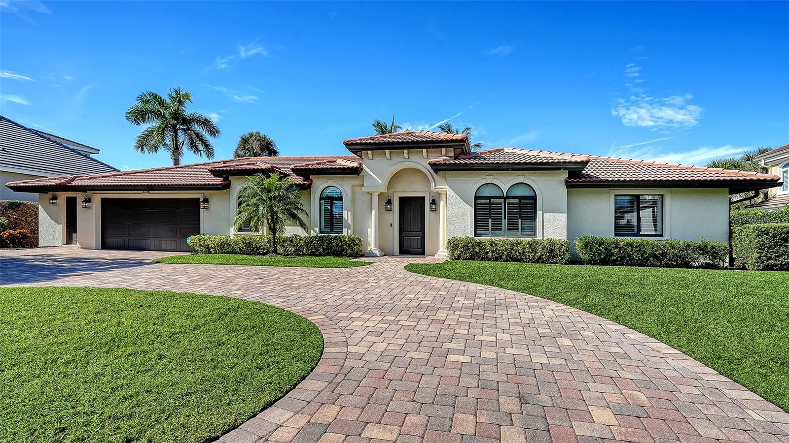 Longboat Key Waterfront Perfection! Experience the ultimate coastal lifestyle in this 4-bedroom, 2.5-bath home, effective year 2016, in the prestigious Country Club Shores community—just three homes from Sarasota Bay with quick access to the Gulf of Mexico. Boater’s paradise with two boat lifts (20,000 lb and 7,000 lb), a new seawall, and private dock complete with a custom fish cleaning station (all 2022–2023). Completely remodeled twice in the last few years, this home blends elegant design and high-end engineering: roof, plumbing, electrical, and PGT hurricane-impact sliding doors and windows throughout, 2 new A/C's 2024. The flowing open-concept floor plan extends to a resort-style outdoor area through retractable glass walls, revealing a heated pool, travertine decking, and inspiring partial Bay views of Sarasota Bay and the Ca’ d’Zan. The showpiece chef’s kitchen sets the standard for luxury with custom Devittori cabinetry, level 5 leathered granite, and a massive 11’x5’ island crafted from a single granite slab. Outfitted with premium Sub-Zero and Wolf appliances, including a 60” range with double ovens, six burners, dual griddles, a pot filler, Sub-Zero wine fridge, refrigerator drawers, and designer hood. Enjoy deeded private beach access, or join the nearby Longboat Key Club for world-class golf, tennis, and dining—all minutes from St. Armands Circle and Downtown Sarasota.  Live the Longboat Key waterfront lifestyle—where boating, beach, and luxury converge in one extraordinary home.