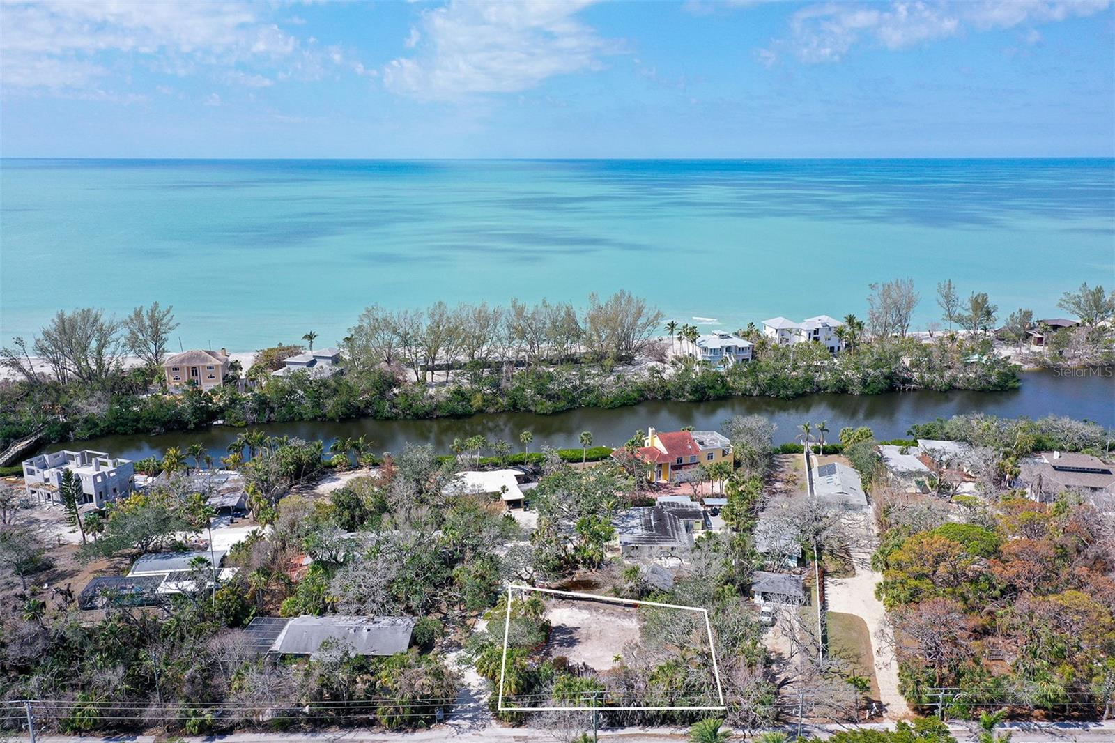 Have you ever built a bonfire on the beach and had 50 of your closest family and friends over for a beach party? This happens no where else on Siesta Key. Residents in the neighborhood enjoy the unique privilege of crossing Heron Lagoon via a private bridge to the sands of Siesta Key beach. There’s a cabana for storing your beach chairs, kayaks and water toys. It’s a one minute walk from your front door to the bridge and another minute to cross it! Here's an opportunity to build your dream home on a pristine, oversized lot nestled on the quiet end of Siesta Key. This exceptional lot offers unparalleled privacy, lush natural surroundings on an expansive corner parcel. Only minutes to restaurants, a marina to house your boat, and beautiful Turtle Beach where you can walk to newly opened Midnight Pass. The previous structure has been removed, and a clean slate is waiting for your vision. Use the Showing Time button to schedule your visit today.
