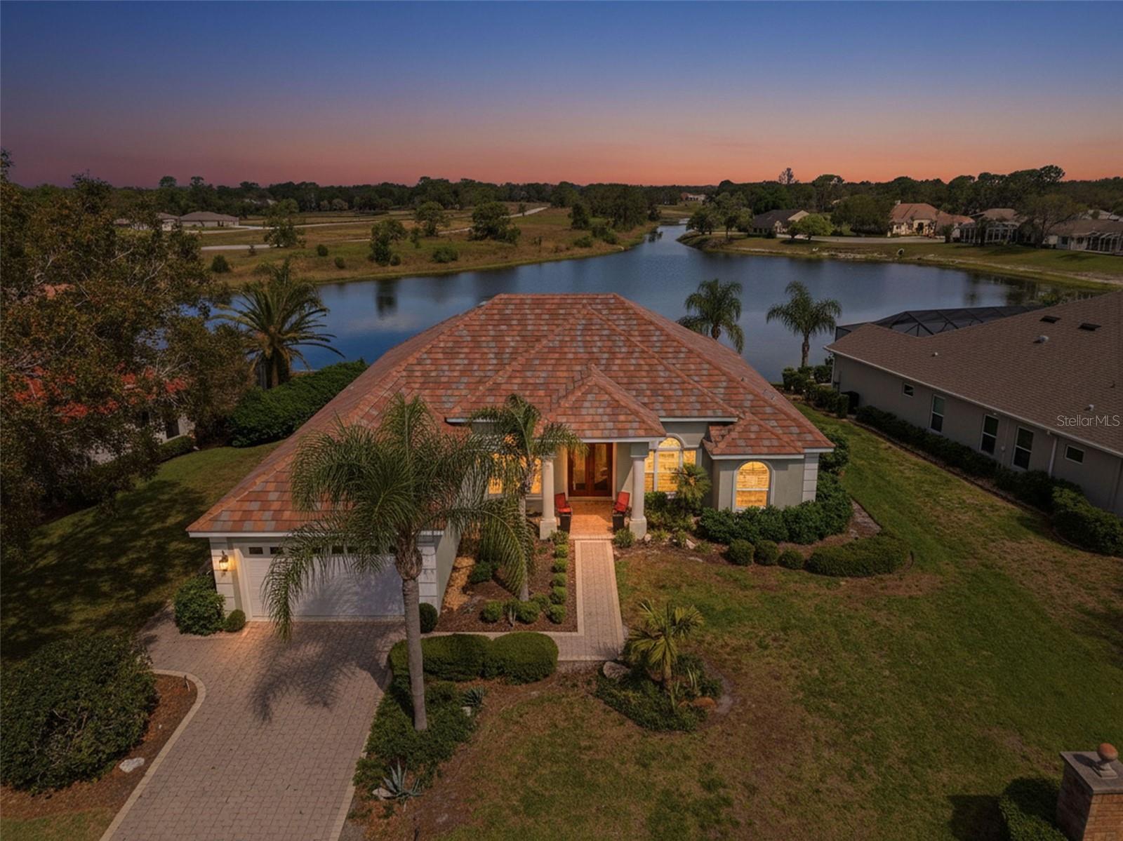 Luxury Lakefront Living In Glen Lakes Country Club. This 3 Bedroom + Office, 3 Bathroom Home Offers 2,851 Living Sq Ft On A .38 Acre Lot With A Tile Roof, Paver Driveway, And A 2 Car Garage With An Oversized Golf Cart Area. Inside, You Are Welcomed By Double Glass Front Doors, 12 Foot Ceilings, Crown Molding, And An Open Layout Where The Living Room, Family Room, And Kitchen All Flow Together While Showcasing Beautiful Pool And Lake Views.

The Kitchen Features Granite Countertops, 42 Inch Wood Cabinets, A Large Center Island, Stainless Steel Appliances, And Ample Storage. Granite Counters Continue In The Bathrooms. The Spacious Primary Suite Offers Wood Flooring, A Sitting Area With Lake Views, Dual Vanities, A Soaking Tub, And A Large Walk-In Shower. A Dedicated Office/Den Behind French Doors Adds Flexible Space For Work Or Relaxation. New Double Pane Windows and Doors, Roof, HVAC, Electrical, and Plumbing in 2016

Step Outside To The Screened Lanai And Private Pool With Paver Decking, Perfect For Enjoying The Direct Lake View. Recent Updates Include Fresh Interior Paint, Comfort Height Toilets, New LED Lights And Fans, A New Pool Pump In 2024, And A Pool Cage Rescreened In 2025. Rebuilt In 2015 Following Fire Damage, The Home Was Renovated Down To The Block With Major Updates Including The Roof, Windows, Electrical, And More.

Located In A 24 Hour Guard Gated Community, GlenLakes Country Club Offers A 35,000 Sq Ft Clubhouse, 18 Hole Golf Course, “The 19th Hole” Bar And Lounge, Tennis, Pickleball, Bridge, Billiards, Bocce, And Fitness Classes Including Water Aerobics, Step Aerobics, And Zumba.