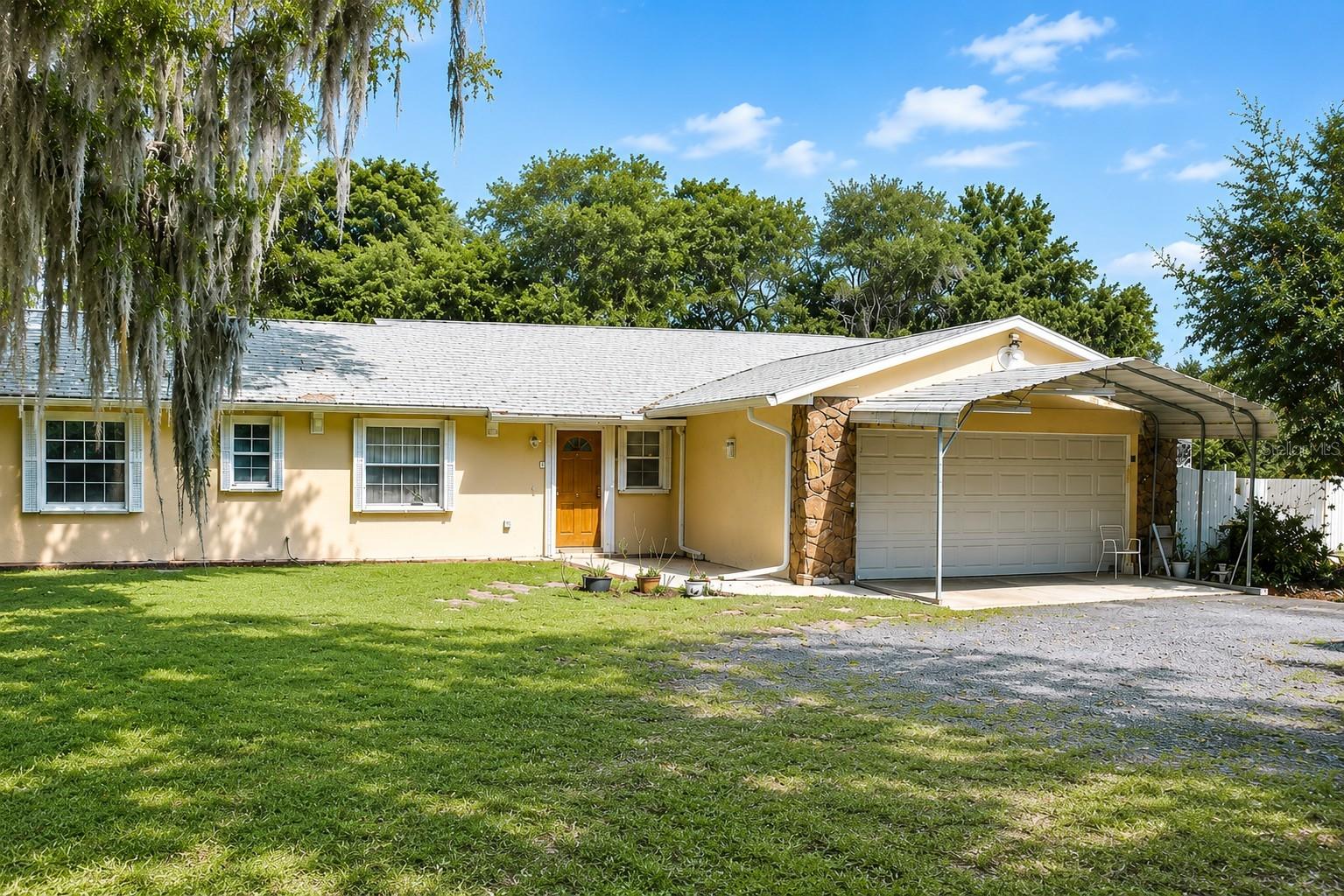 Hurricane Ready Home. Discover the perfect blend of privacy, functionality, and peace of mind in this well-maintained 4-bedroom, 2-bath home situated on a quiet 1.03-acre lot in Mims backing to a serene 115-acre preserve. With no HOA, low traffic, speed bumps, and a spacious setting surrounded by nature, this property offers the ideal balance of comfort and flexibility for everyday living, hobbies, and entertaining.

Designed for efficiency and storm preparedness, the home features a Fully Owned 10kW solar system, resulting in exceptionally low electric costs per seller, along with a Generac 16kW whole-house generator connected to an owned 250-gallon propane tank. Additional upgrades include accordion hurricane shutters, hurricane-rated garage door, lightning protection system, whole-house surge suppressors, security cameras, ADT alarm system, seamless gutters, and a complete roof replacement completed in 2025 with warranty.

Inside, the spacious layout offers 2,360 square feet of living space with updated bathrooms, widened 32-inch bath doorways, newer LG refrigerator, reverse osmosis system, water softener, iron filtration system, and updated kitchen counters and sink. The home also features a “secret room,” adding a unique bonus space ideal for storage, office, hobby room, or creative use.

Car enthusiasts, hobbyists, and business owners will appreciate the impressive 25’x16’ steel building Garage Workshop equipped with a commercial-grade automotive lift, along with attached and detached garage parking, front carport, fenced entry gate, storage sheds, and abundant off-street parking.

Enjoy peaceful evenings overlooking the preserve, friendly neighbors, and even rocket launch views from your backyard. Conveniently located near Cuyler Park with sports courts, pavilions, trails, and recreation nearby, this unique property combines upgraded infrastructure, energy efficiency, privacy, and lifestyle in one exceptional opportunity. Seller is giving one year –SELECT HOME WARRANTY SERVICE.