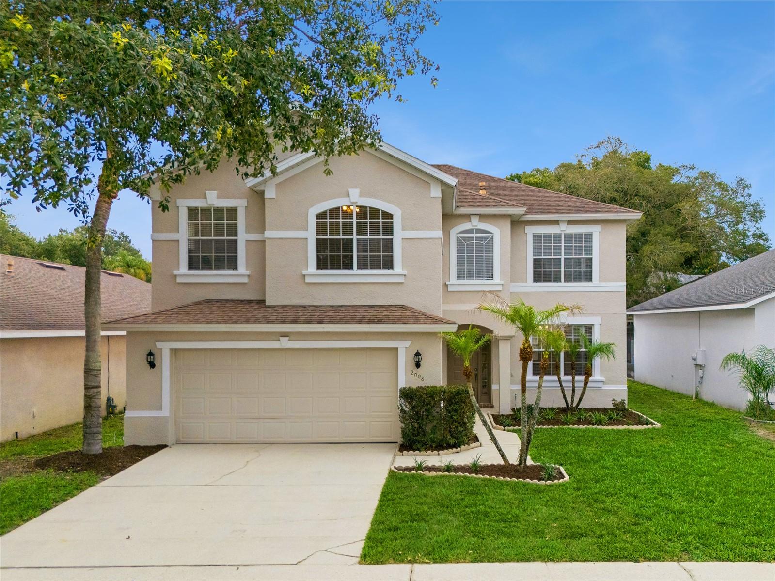 Move-in ready, ideally located, and packed with valuable upgrades, this beautifully maintained 4-bedroom, 2.5-bath home is ideally located just off Alafaya Trail, offering quick access to SR 417, UCF, Oviedo Mall, Waterford Lakes Town Center, Central Florida Research Park, shopping, dining, and major commuter routes. Just a 2-minute walk from highly rated Evans Elementary, this location makes busy school mornings and afternoon pick-ups a breeze.Recent updates include fresh interior and exterior paint, newly painted kitchen cabinetry, doors, and baseboards, refreshed landscaping, a new fence (2025), HVAC replacement (2021), and water heater replacement (2023). The home also features granite countertops, stainless steel appliances, a 240V EV/Tesla charging outlet, and an ADT security system with pre-wiring and control panel, offering both modern convenience and peace of mind.The desirable east-west orientation fills the home with abundant natural light throughout the day, while the east-facing backyard provides comfortable evening shade for outdoor dining, entertaining, and after-school play. A unique lot orientation creates a surprisingly open backyard feel rarely found in traditional subdivision homes, while neighboring single-story homes on both sides further enhance privacy.Additional highlights include an oversized bonus room, no carpet throughout the home, a spacious screened lanai, and a custom-built garage storage system providing excellent organization and storage space.Combining major updates, exceptional privacy, abundant natural light, and an unbeatable Oviedo location, this home is truly move-in ready and waiting for its next owner.