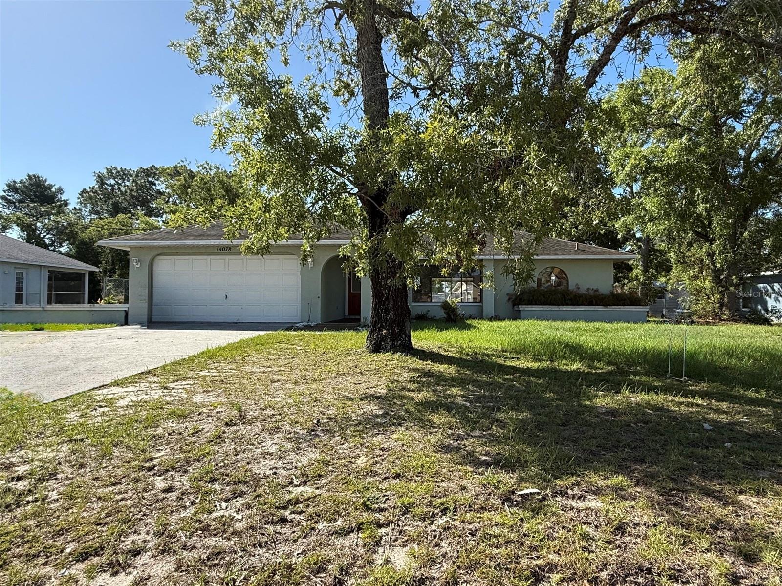 Welcome home to this 2/2/2 situated on an oversized, fenced lot in the heart of Spring Hill. Offering a spacious and functional layout, this home features comfortable living areas, generous bedroom sizes, and plenty of room to make it your own. Featuring a split bedroom layout, great room, and a primary ensuite with a walk-in closet, private outdoor access, and an attached bathroom. Step outside and enjoy the large screened lanai, the perfect place to relax with your morning coffee, entertain guests, or enjoy Florida's beautiful weather year-round. The oversized yard provides ample space for gardening, outdoor activities, pets, or future enhancements. Conveniently located less than a mile from shopping, dining, and major roadways, this property combines comfort, space, and convenience. Permits indicate roof replaced in 2015 and HVAC in 2012. Schedule your showing today!
