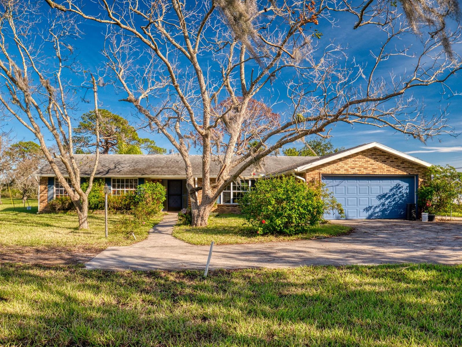 This Magnificent home situated on 2 acres of Canal Front on Turnbull Creek awaits you and your vision to remodel it. Centrally located in NSB on a private road the possibilities are endless. NO HOA! 4 bedrooms, 2 & 1/2 half bathrooms with an attached two car garage and a detached workshop boasts 2559 square feet under air and a beautiful yard. The home is located in the County but Buyer can annex into the city if they wanted to. Come see it before it is gone. A renovation loan might be a good idea for this home! ;Water: City