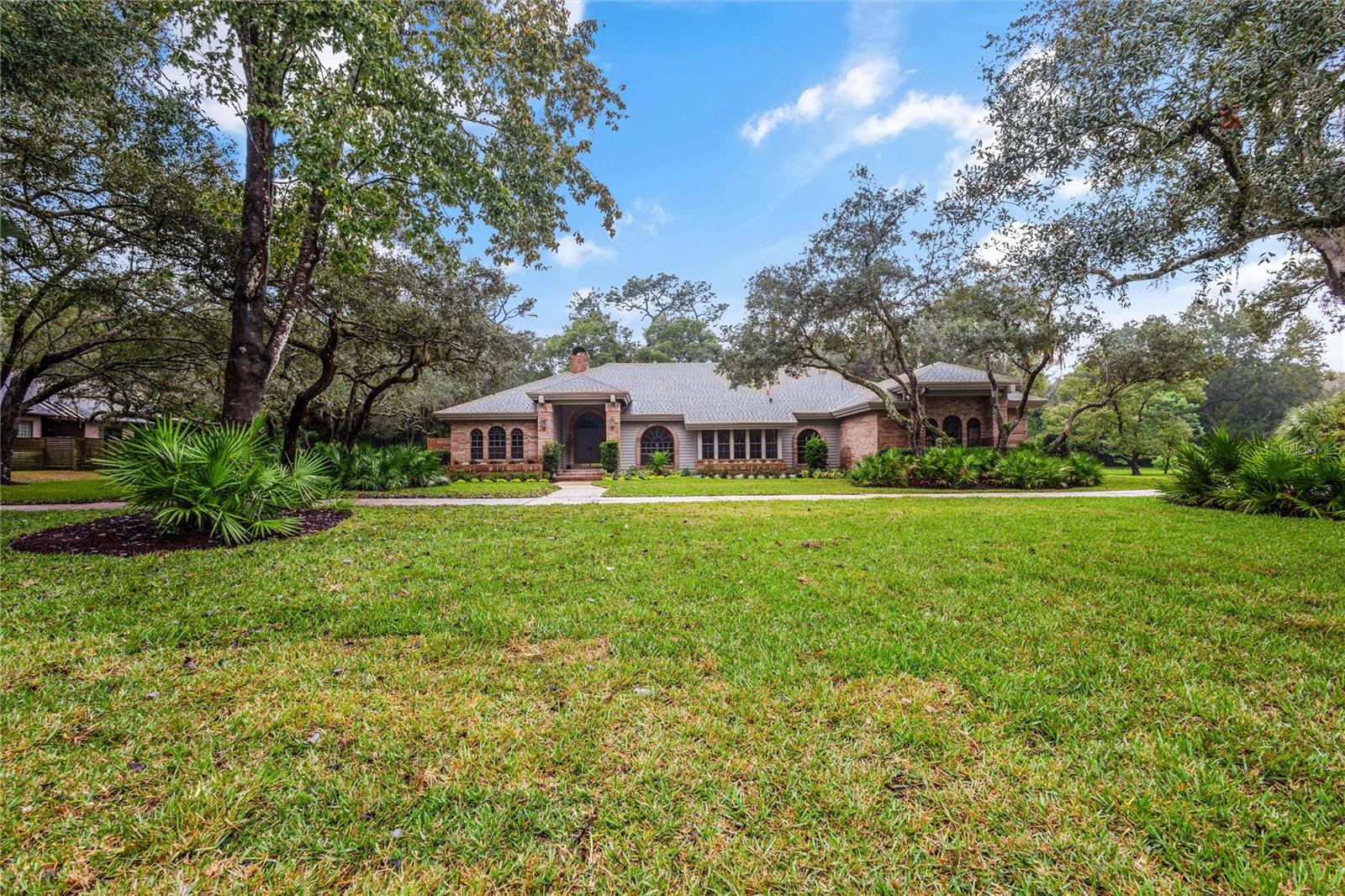 Welcome to the Estates at Springs Landings located in the beautiful Markham Woods corridor in Longwood FL! This home has just completed a full makeover, adding some of the most up to date trends and materials. With over 3300 sq ft of living space, this beauty has 5 bedrooms and 3 full bathrooms with a lot of extra living space for all your needs. Every room has large closets with all new stained wood shelving throughout. There is also a huge laundry room with plenty of storage! The kitchen has undergone a full renovation with all new wood/soft close cabinets, level 4 quartz countertops, all new appliances etc.  All bathrooms have been upgraded with luxury tile selections and new vanities giving this home a brand new feel.  Both AC units are brand new as well as the water heater. The home itself sits on over an acre of land which has just been totally re sodded with St. Augustine grass, re landscaped, and newly irrigated.  The oversized pool has just been resurfaced as well with new knockdown texture and paint over the large pool deck. The screen enclosure was also just totally re-screened! Plenty of parking space with a large circular driveway and oversized doored 3 car garage. Come be a part of this beautiful quiet neighborhood today!