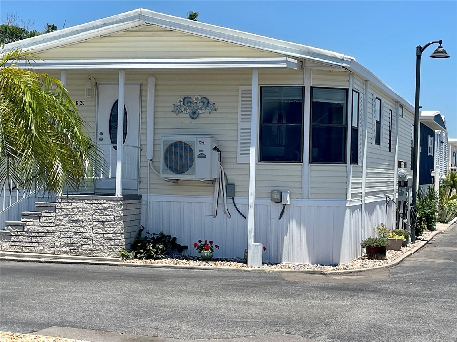 WELCOME TO PARADISE!  This unit epitomizes the perfect beach home.  When you step through the front door, you will know that you have entered “House Beautiful”.  The blend of colors and furnishings will make you feel that you are home.  This home features a nice-sized living room, totally upgraded separate kitchen and dining room, two bathrooms and two bedrooms.  This home has 1,052 sq. ft. of living area.
This home is located just steps from Sarasota Bay.  There are limited views of Sarasota Bay from the Living Room, Dining Room, Kitchen and the second bedroom.  It has a new Mini Split A/C, and hot water heater.  The roof is vinyl and has a brand new elastomeric coating with a 5 year warranty.  This unit also has new skirting and new edging on the roof soffits.
Gulfshore of Longboat Key is located on a perfect parcel of land.  It has it all – private access to a pristine sand beach on the turquoise waters of the Gulf of Mexico, a marina on Sarasota Bay, large community pool, clubhouse with a commercial kitchen, a well-maintained and managed campus and very reasonable HOA fees. Truly, Gulfshore is a remnant of Old Florida that is just six miles from the world-famous St. Armand’s Circle.  Gulfshore does not permit rentals or pets and it is a 55+ community.  Please call now for an appointment to view your future home and relax in paradise.