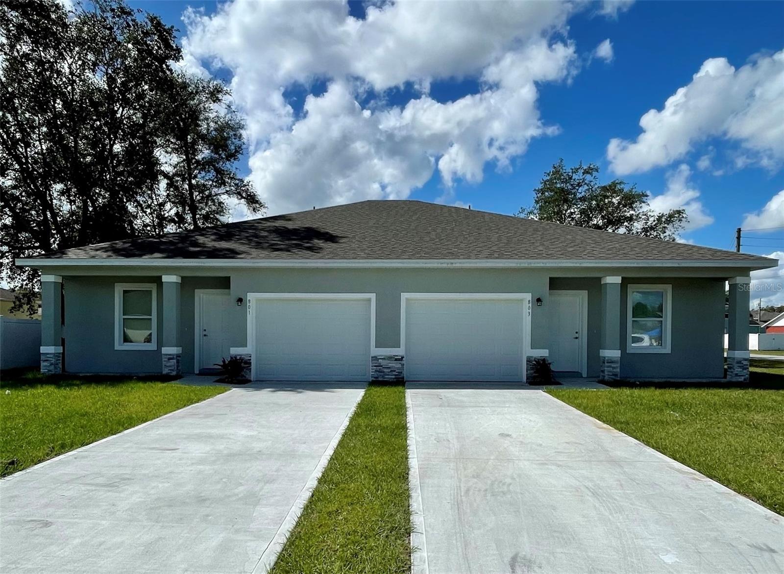 Virtually Staged. Be the First to Live in This Stunning Brand-New Home in Poinciana!

Welcome to your dream home! Be the very first to live in this beautifully crafted, brand-new 3-bedroom, 2-bath residence located on the desirable Polk County side of Poinciana. Designed with modern elegance, quality craftsmanship, and everyday comfort in mind, this exceptional home offers everything you need for the perfect Florida lifestyle. Step inside to discover a bright, open-concept floor plan featuring gorgeous 6" x 24" wood-look ceramic tile flooring throughout, creating a seamless blend of style and easy maintenance. The chef-inspired kitchen is the true centerpiece of the home, boasting soft-close wood cabinetry, abundant countertop space, stainless-steel appliances, upgraded lighting, and a spacious breakfast nook. The oversized breakfast bar comfortably seats four, making it the perfect gathering place for family meals or entertaining friends.

The spacious primary suite offers a private retreat complete with a luxurious bathroom featuring a glass-enclosed walk-in shower and elegant marble-look finishes. The secondary bathroom is equally impressive with stylish marble-look tile surrounding the tub and shower. Additional highlights include an indoor laundry room, premium finishes throughout, and solid construction designed to provide lasting comfort and peace of mind.

Whether you're hosting game day with friends, enjoying family movie nights, or simply relaxing after a long day, this home provides the perfect space to create lasting memories. Conveniently located just 30 minutes from Orlando's world-famous theme parks and only minutes from shopping, restaurants, schools, hospitals, public transportation, and everyday conveniences, you'll enjoy the perfect combination of tranquility and accessibility. Don't miss this incredible opportunity to be the very first to call this stunning new home your own. Schedule your private tour today before it's gone!