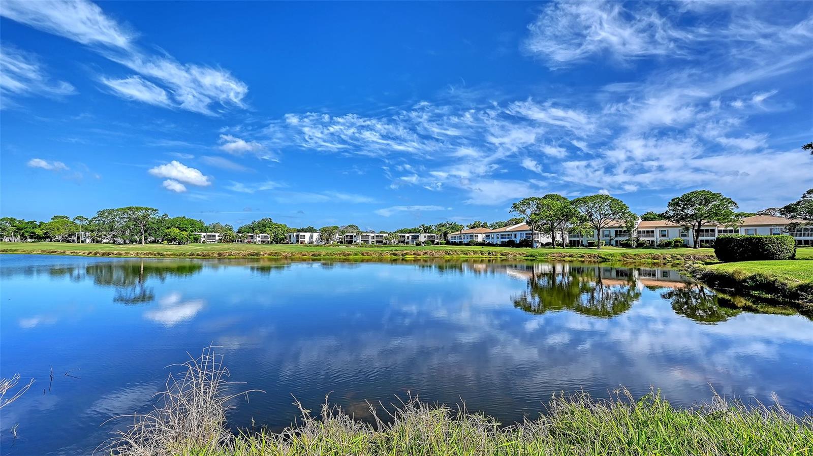 Super Clean and move in Ready! Outstanding unit in the Meadows. Enjoy the view every day! Wonderful view of Golf Course and pond, just outside your window. The Meadows offers loads of activities and this unit has a Wonderful Water View/Golf Course View from this second floor end unit condo. This condo has been well maintained and lovely cared for by its long time owner. Enjoy your morning coffee from your second floor enclosed lanai overlooking the well maintained 18 hole golf course, managed by Benderson Properties. Lanai has A/C vents for heating and cooling. Stack washer/dryer is in the unit. A/C is well maintained with Ultra Violet light. Super clean and easy to maintain with tile throughout. (NO Carpet). The kitchen has been updated with lots of pull out storage. This end unit is light and bright with morning sun shine. One assigned parking space but many guest spaces available. The Meadows is a fantastic community featuring an exceptional 1,600 acres offering miles of walking and bike paths, shopping steps from your door featuring Spas, Salons, Pub, Restaurant, Dental Services and so much more. Your quarterly condo fee includes a Health & Wellness Center membership. The Renaissance card entitles you to participate in a selection of activities including an Olympic Size Pool, Pickle Ball & Tennis Courts, Aerobics Classes and numerous social activities including Ice Cream Social, Art Show, Photo Show, Arts & Craft events, Special Lectures on popular topics and so much more. Never a dull moment in Season when you visit the Farmers Market on Sundays. This beautiful Community boasts of abundance of canopied oaks, over 85 lakes and waterways, 14 miles of walking and bike trails and 54 holes of Golf. The Meadows is conveniently located close to I-75, University Town Center, Nathan Benderson Park and a short drive the SRQ Airport. Contact The Meadows for information about joining.