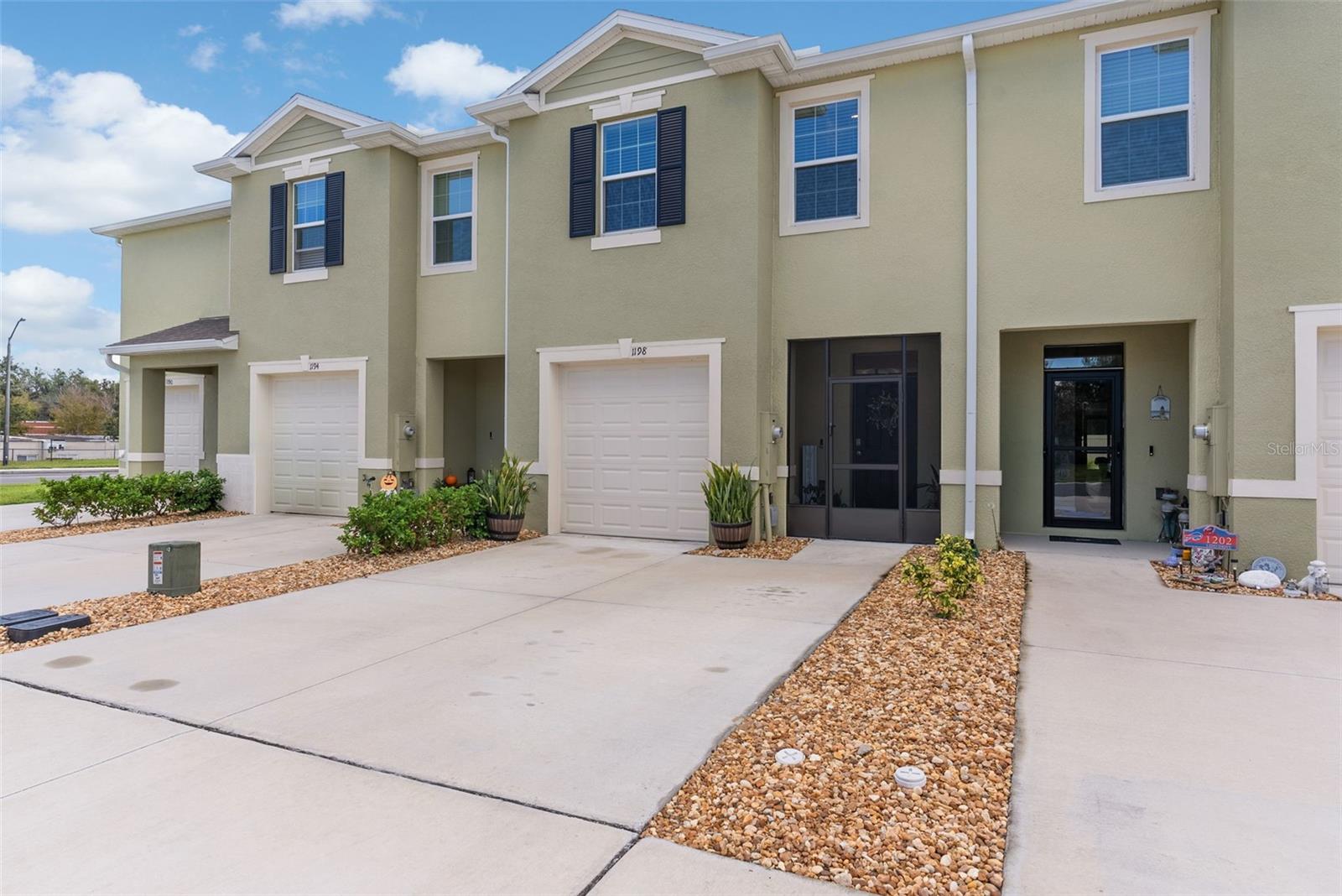 One or more photo(s) has been virtually staged. Discover modern living in the charming lakeside town of Howey-in-the-Hills. Built in 2024, this nearly new 3-bedroom, 2.5-bath town home blends contemporary comfort with a relaxed, small-town lifestyle—offering the perfect balance of convenience and tranquility.
Step into a welcoming foyer that opens to a spacious, open-concept floor plan, filled with natural light and neutral, modern finishes. The heart of the home—a beautifully designed kitchen—features granite countertops, sleek white cabinetry, and an easy flow into the dining and living areas, creating an ideal space for everyday living and effortless entertaining.
Enjoy quiet mornings on the screened front porch, and unwind in the evening on the enclosed back lanai, surrounded by peaceful surroundings. Upstairs, a versatile loft area serves perfectly as an office, cozy lounge, or play space. Retreat to the en-suite primary bedroom, complete with his-and-hers closets, while two additional generously sized bedrooms offer comfort and storage galore.
Here, home extends beyond your front door. Just moments from the sparkling waters of Little Lake Harris, you can start the day with a peaceful lakeside walk or enjoy a leisurely stroll to Boondock’s Bar & Grill for waterfront dining. Spend afternoons exploring the historic Howey Mansion, teeing off at Mission Inn Resort & Golf Club, or discovering nearby parks and nature trails.
Perfectly situated in Central Florida, this quiet community offers quick access to the Florida Turnpike, making travel a breeze. Walt Disney World®, Universal Studios®, and Orlando attractions are only 35–45 minutes away—close enough for adventure, yet far enough to enjoy the serenity of home.
This is more than a town home—it's a chance to enjoy modern comfort, charm, and a lifestyle that feels like you're on vacation every day. Welcome home to Howey-in-the-Hills.