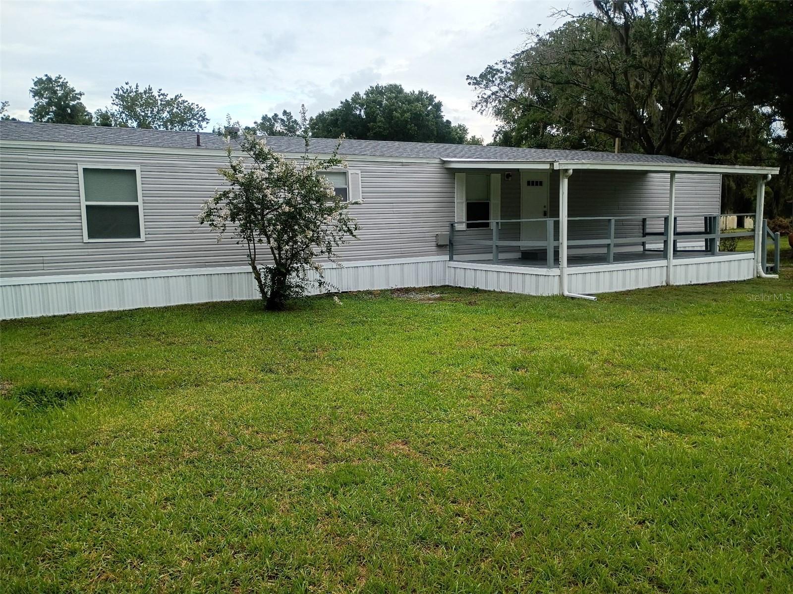 Completely Renovated & Move-In Ready on 1 Acre in North Lakeland – No HOA!

Don’t miss this beautifully renovated 1999 manufactured home situated on a spacious 1-acre lot in desirable North Lakeland with no HOA restrictions. This move-in ready property offers 924 square feet of living area featuring 3 bedrooms and 2 full bathrooms, making it the perfect option for first-time buyers, downsizers, or anyone looking for affordable country-style living with modern updates.

Step inside and enjoy a completely updated interior that feels like new, featuring brand-new kitchen cabinets, new appliances, upgraded bathrooms, new water heater, new carpet, luxury vinyl flooring, fresh interior paint, and new trim throughout. Major exterior and mechanical improvements provide peace of mind for years to come, including a new roof, new A/C system, new skirting, and a brand-new well.

Relax on the covered front porch overlooking the property and enjoy plenty of outdoor space for gardening, recreation, pets, or future additions. A large storage building in the backyard provides excellent space for tools, equipment, storage, or hobbies. The home is serviced by private well and septic, helping reduce monthly utility expenses.

Conveniently located in North Lakeland with easy access to shopping, dining, schools, and major roadways while still offering the privacy and freedom of country living. Homes with this level of renovation and acreage at this price point are hard to find — schedule your showing today!