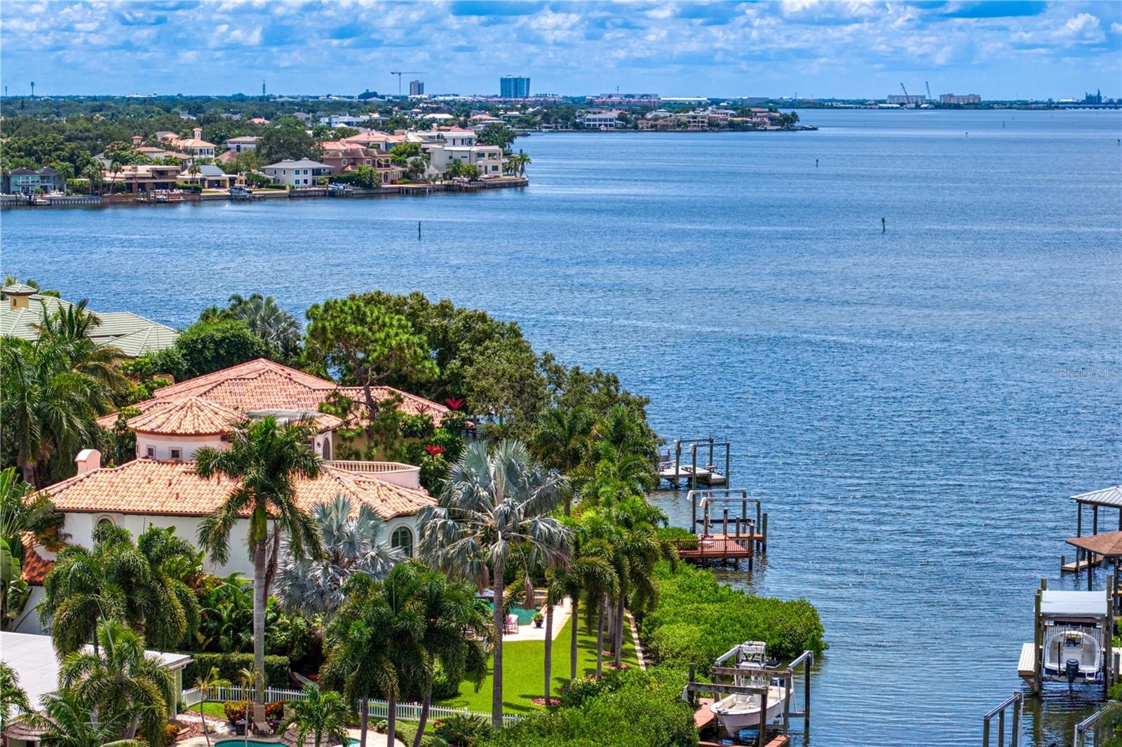 Located in the sought-after Beach Park neighborhood of South Tampa, this exceptional waterfront residence offers a rare blend of refined design and sweeping open-water views across Tampa Bay to St. Petersburg. Custom built and designed by Thomas Everett Lamb; the home embodies timeless elegance while embracing a sophisticated coastal lifestyle.
Thoughtfully designed for privacy and comfort, each bedroom functions as a private suite with well-appointed bathrooms, ideal for both everyday living and hosting guests. The primary suite serves as a serene retreat, highlighted by tranquil water views and an atmosphere of quiet luxury.
Throughout the home, meticulous craftsmanship and custom finishes underscore the integrity of the design. Expansive windows and intentional sightlines capture panoramic bay views while filling the interiors with natural light. The main living areas flow seamlessly, creating an inviting environment for relaxed living and elegant entertaining. Whether hosting intimate gatherings or larger celebrations, the layout balances beauty and functionality with ease.
Designed to embrace its waterfront setting, the home offers an exceptional indoor-outdoor lifestyle. Enjoy peaceful mornings overlooking the bay, watch boats glide by throughout the day, and experience stunning sunsets stretching toward St. Petersburg. Direct access to Tampa Bay provides endless opportunities for boating and water activities, perfectly complementing Florida’s coastal way of life.
This is a rare opportunity to own a custom waterfront residence where timeless design, premier location, and breathtaking views come together.