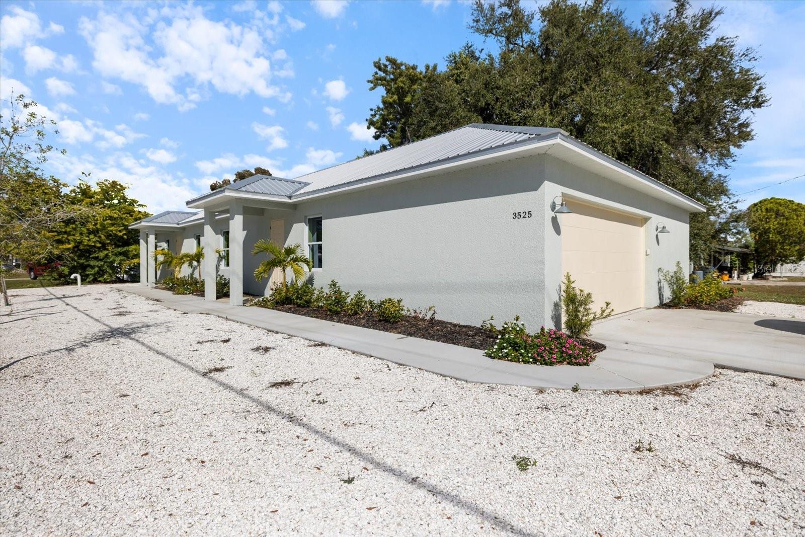 One or more photo(s) has been virtually staged. This newly constructed home, complete with a fully equipped mother-in-law suite (ADU), offers the perfect combination of modern design, flexibility, and a prime Sarasota location. Thoughtfully designed with functionality in mind, the property is ideal for multi-generational living, hosting family and guests, or generating additional income.

The main home features a bright, open-concept layout with abundant kitchen cabinetry, stone countertops, stainless steel appliances, and elegant hardwood flooring throughout. The spacious kitchen provides plenty of storage and prep space, while natural light fills the living areas, creating a warm yet contemporary atmosphere.

What truly sets this property apart is the private ADU, designed to feel like a home of its own. With a separate entrance, comfortable living area, full kitchen, bedroom with generous closet space, modern bathroom, and its own private laundry, this space offers complete independence and privacy, perfect for extended family, long-term guests, or rental opportunities. This property is also NOT in a flood zone so flood insurance will not be needed! 

Located just minutes from Siesta Key Beach with convenient access to I-75 and the Legacy Trail, this home provides easy access to Sarasota’s top beaches, dining, shopping, and outdoor recreation. With brand-new construction, no HOA, and no CDD fees, this is a rare opportunity to own a versatile, move-in ready property in one of Sarasota’s most desirable and accessible locations.