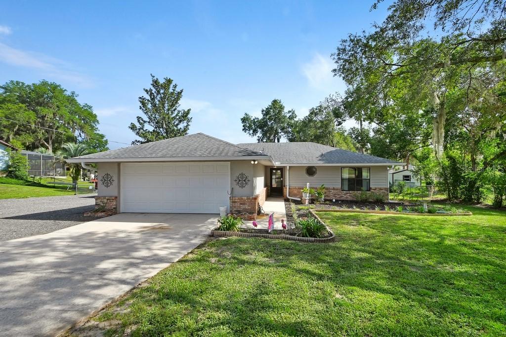 Nestled in the charming rural community of De Leon Springs, discover a truly inviting place to call home. This delightful 3-bedroom, 2-bathroom block and stucco residence offers comfort and durability, perfectly situated on a sprawling 100 x 200-foot lot with room for your RV or Boat. There is no Homeowners Association. Imagine morning coffee in your private, fenced backyard, ideal for pets, play, or simply unwinding in the tranquility of country living. This split bedroom plan has a living room with cathedral ceiling. The updated kitchen is both stylish and functional, offering quartz countertop, stainless steel sink, soft close drawers and stainless-steel appliances. Other bonuses include a complete new septic tank & drainfield. One of the home's standout features is the 430 square foot Florida Room providing the perfect space for entertaining, relaxing, or enjoying year-round views of the private, fenced backyard. This bright and inviting room showcases luxury vinyl plank flooring, a beautiful wood-paneled ceiling, and plenty of natural light. The Primary Bathroom has updated tile shower, vanity, and Quartz Counter-top. With a spacious 594 sq ft garage, there's ample room for vehicles, hobbies, or all your outdoor gear.
Living in De Leon Springs one can, embrace the slower pace of life, just moments from natural wonders like Ponce De Leon Springs State Park and the expansive Lake Woodruff Wildlife Refuge. Outdoor enthusiasts will adore the proximity to Chuck Lennon Park, featuring baseball, soccer, pickleball, tennis courts, and fantastic mountain bike trails, plus the renowned Spring-to-Spring paved trail for walking and cycling. Enjoy the best of both worlds with easy access to big-city amenities; you're only 45 minutes from the World's Most Famous Beach in Daytona and an hour from Orlando's famous attractions. Don't miss the opportunity to make this wonderful property your own. Schedule your private tour today!