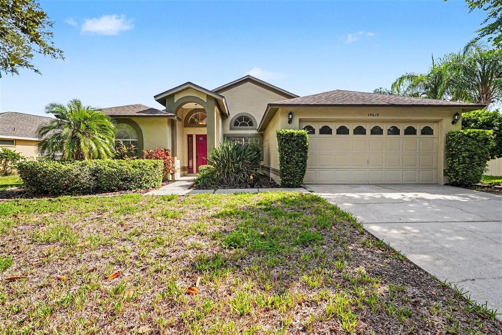 Virtually Staged. Welcome to this spacious 4-bedroom, 2-bathroom home in the quiet Odessa community of Wyndham Lakes. Situated on a quarter-acre lot, this home offers a split-bedroom floor plan, multiple living areas and a large backyard with plenty of room to make it your own. The freshly painted interior features a formal sitting room, dining area and a comfortable family room with luxury vinyl plank flooring and a wood-burning fireplace. The updated kitchen is the heart of the home, showcasing quartz countertops, stainless steel appliances, a built-in range, custom pantry cabinetry and stylish gold finishes. The primary suite includes luxury vinyl plank flooring, sliding doors leading to the screened lanai and an updated bathroom with quartz countertops, new mirrors and new shower glass. Outdoor living is easy with multiple access points to the screened lanai, including French doors from the sitting room, sliding doors from the primary bedroom and a separate door from the breakfast nook. The oversized backyard is partially enclosed by neighboring and rear fencing and could easily be fully fenced by adding fencing along just one side. Additional features include an interior laundry room with a utility sink and space for extra storage, a newly replaced HVAC and a 2023 water heater. Wyndham Lakes offers low HOA fees and a peaceful neighborhood setting while remaining conveniently located near restaurants, entertainment, shopping and the Veterans Expressway. The home is also zoned for A-rated schools, making it a wonderful opportunity to enjoy space, updates and convenience in the heart of Odessa.