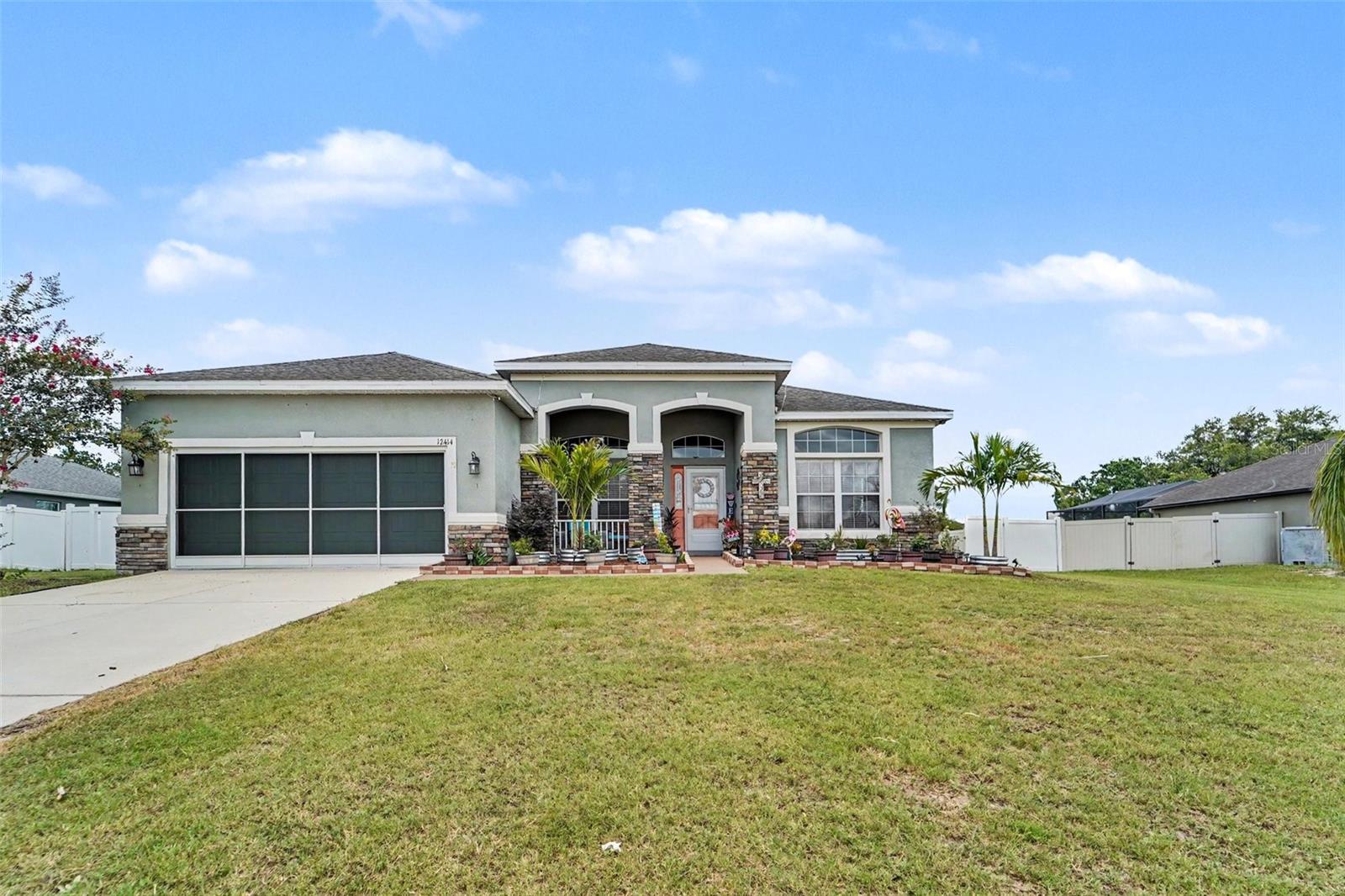 Welcome to this beautifully maintained 2015 home in the desirable Oak Glen community! This home offers 2,106 square feet of thoughtfully designed living space with 3 bedrooms and 2 baths. It features a fully renovated kitchen with a custom built-in coffee bar and double ovens—perfect for entertaining and everyday living. Enjoy seamless indoor-outdoor entertaining in the finished enclosed porch overlooking your expansive 0.34-acre lot — ideal for morning coffee, weekend gatherings, and pool days. The oversized finished garage provides excellent storage and flexibility. Nestled in peaceful Oak Glen with community ponds, you’re minutes from charming downtown San Antonio, Saint Leo University, top shopping and dining in Wesley Chapel, and quick I-75 access to Tampa and the Gulf beaches for boating and sun-soaked weekends. With low HOA fees, NO CDD, public water, and move-in-ready condition, this home offers exceptional value and lifestyle. Whether you’re a retiree seeking relaxation, a young professional wanting convenience, a growing family, or an investor — this property checks every box. Don’t miss this opportunity. Schedule your private showing today and start enjoying the vibrant, relaxed Florida lifestyle you deserve!