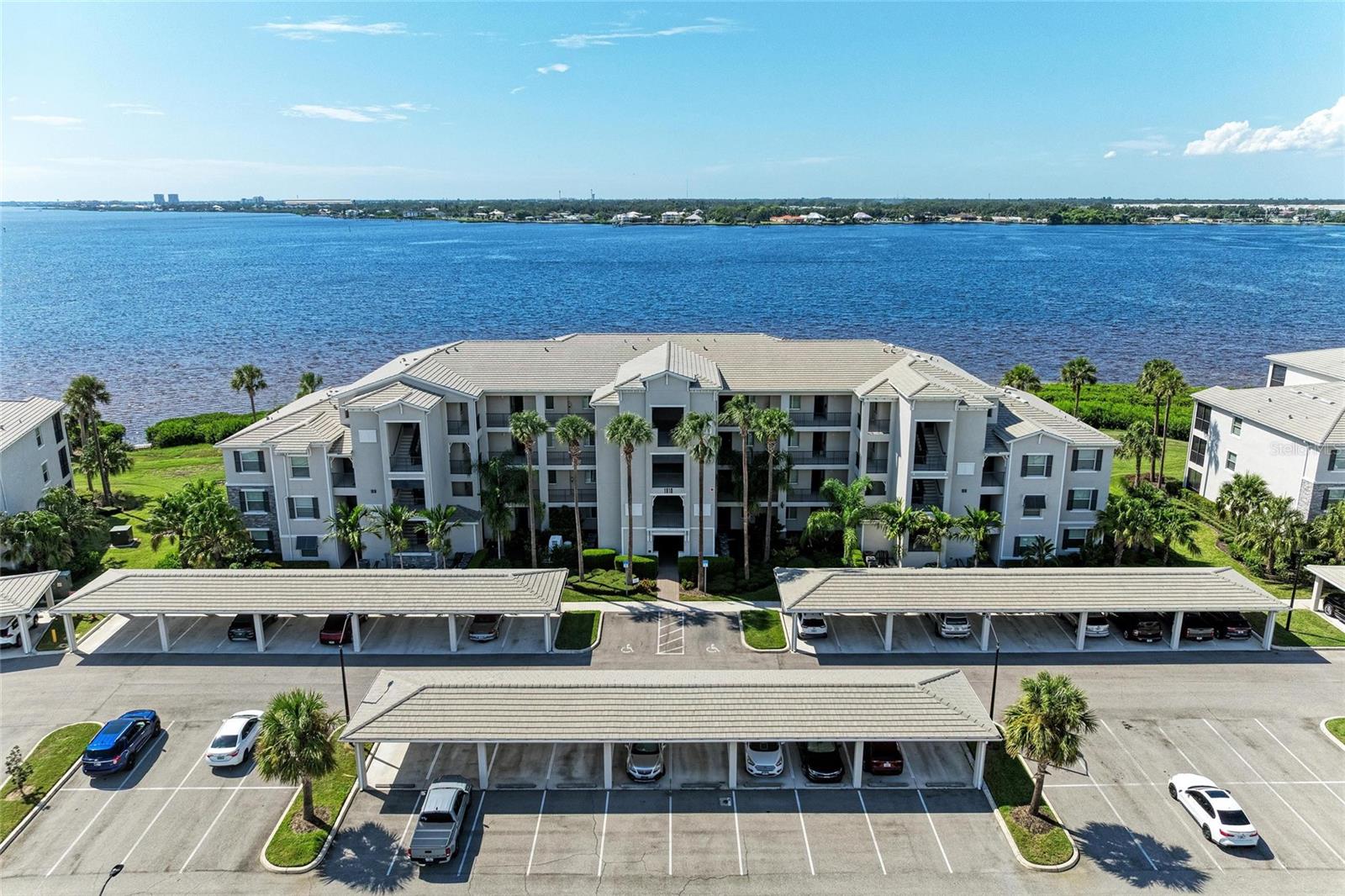 Wake up to dolphins at play, end your day with fiery sunsets, and discover the riverfront paradise you’ve been dreaming of. This dreamy 2-bedroom, 2-bathroom condo, is perfectly positioned on the 3rd floor, creating the feeling of your own private retreat above the water. The kitchen serves as the heart of the home, featuring stainless steel appliances, quartz countertops, a spacious island with double sink, crown molding, and custom wood cabinetry. The open-concept layout is designed for effortless gatherings with family and friends.
The owner’s suite provides direct river views, two walk-in closets, and a spa-like bathroom with a walk-in shower. The guest bedroom provides a quiet retreat, while the guest bathroom includes a full-size washer and dryer neatly tucked into a dedicated laundry closet for added convenience. An assigned covered parking space and storage unit provide practical extras. Relax on the screened balcony, where dolphins and manatees play in the river and nightly sunsets paint the sky.
Tidewater Preserve is a 24/7 guard-gated, resort-style community along the Manatee River. Residents enjoy a clubhouse, fitness centers, three pools (including lap lanes), har-tru tennis courts, dog park, playground, walking trails, and a riverfront lodge with fireplace and grills. Boaters appreciate the onsite marina with rental slips (max 32 ft., subject to availability), community boat ramp, and private kayak/canoe launch with racks available. Conveniently located near I-75, Lakewood Ranch, world-class beaches, shopping, dining, and golf.
Life at Tidewater Preserve is where paradise becomes home.