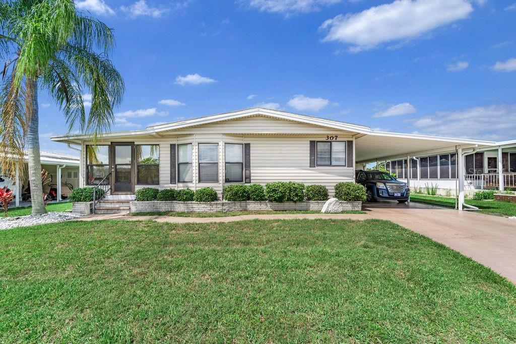 Welcome to Kings Gate, a highly sought-after 55+ community in Nokomis! This well-maintained 2-bedroom, 2-bath manufactured home provides comfortable living with a spacious layout and numerous updates. The home features a large living room, a bright kitchen with ample cabinetry, and built-in dining room storage. Enjoy year-round use of the finished enclosed lanai, complete with its own heating and cooling unit. Truly move in ready with ALL FURNITURE INCLUDED! Additional features include a covered carport, storage shed with laundry area, and an extra refrigerator for added convenience. Kings Gate Club is perfect for those with an active lifestyle. With an extensive amenity package, including a clubhouse, fitness center, sauna, heated pool, hot tub, pickleball, tennis, shuffleboard, bocce ball, mini golf, game room, craft room, woodworking shop, and a full calendar of social activities, there's always something to do! Residents also enjoy private canal access with a boat ramp and RV/boat storage. HOA dues include cable, internet, water, sewer, trash, lawn care, and maintenance of community amenities.  Being Sold As-Is.