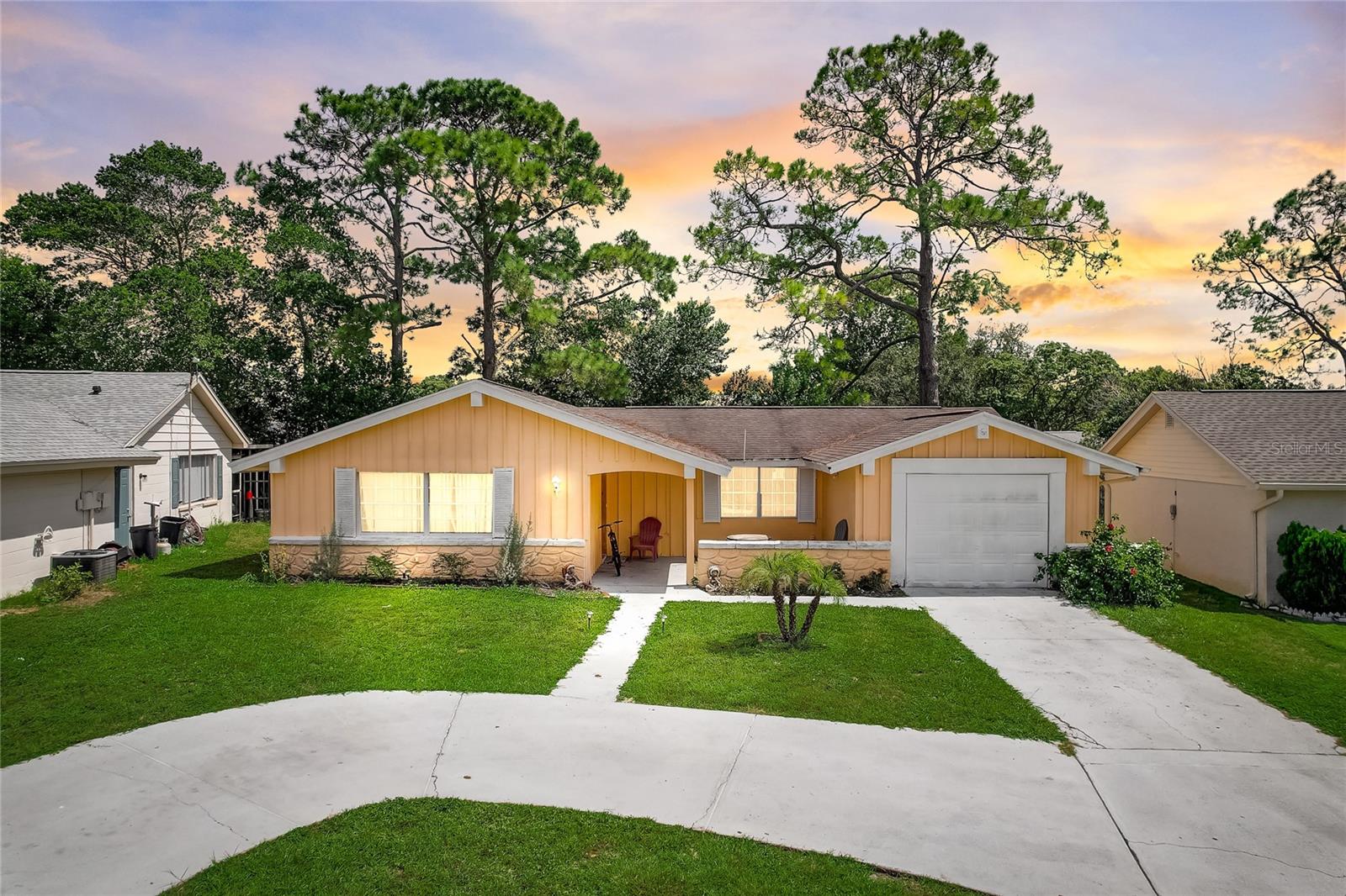 NEW ROOF TO BE INSTALLED BY TIME OF CLOSING. Ask me how this can help you save on homeowners insurance costs! Step into the enchanting world of this adorable 4-bedroom, 2-bathroom gem, ideally situated in the sought-after Beacon Woods neighborhood. With an emphasis on spaciousness and comfort, this home beckons you to embrace a life of convenience, tranquility and beautiful upgrades throughout including completely remodeled bathrooms and kitchen and NEWER A/C. As you enter, you'll be greeted by a generously sized living area that effortlessly combines a dining room and family room. This inviting space is perfect for entertaining loved ones and creating cherished memories. The L-shaped kitchen, complete with a charming breakfast nook, provides the canvas for your culinary dreams to come to life. Whether you're a seasoned chef or just love to experiment in the kitchen, this space will inspire your inner foodie. One of the home's standout features is the converted garage, which is currently being used as a fifth bedroom. The convenience of an exterior door allows for a possible efficiency conversion. Escape to your private sanctuary in the master bedroom suite, complete with a well-appointed bathroom and a roomy walk-in closet. Step outside to discover an enclosed patio in the back, that adjoins to the sliding glass doors; leading you to an additional living space currently being used as a game room. With shopping, schools, and a serene bird sanctuary all just a stone's throw away, this home's location couldn't be more ideal. Your dream home awaits – don't let this opportunity slip through your fingers. Schedule your showing today, and embark on a journey to make this charming property your very own!